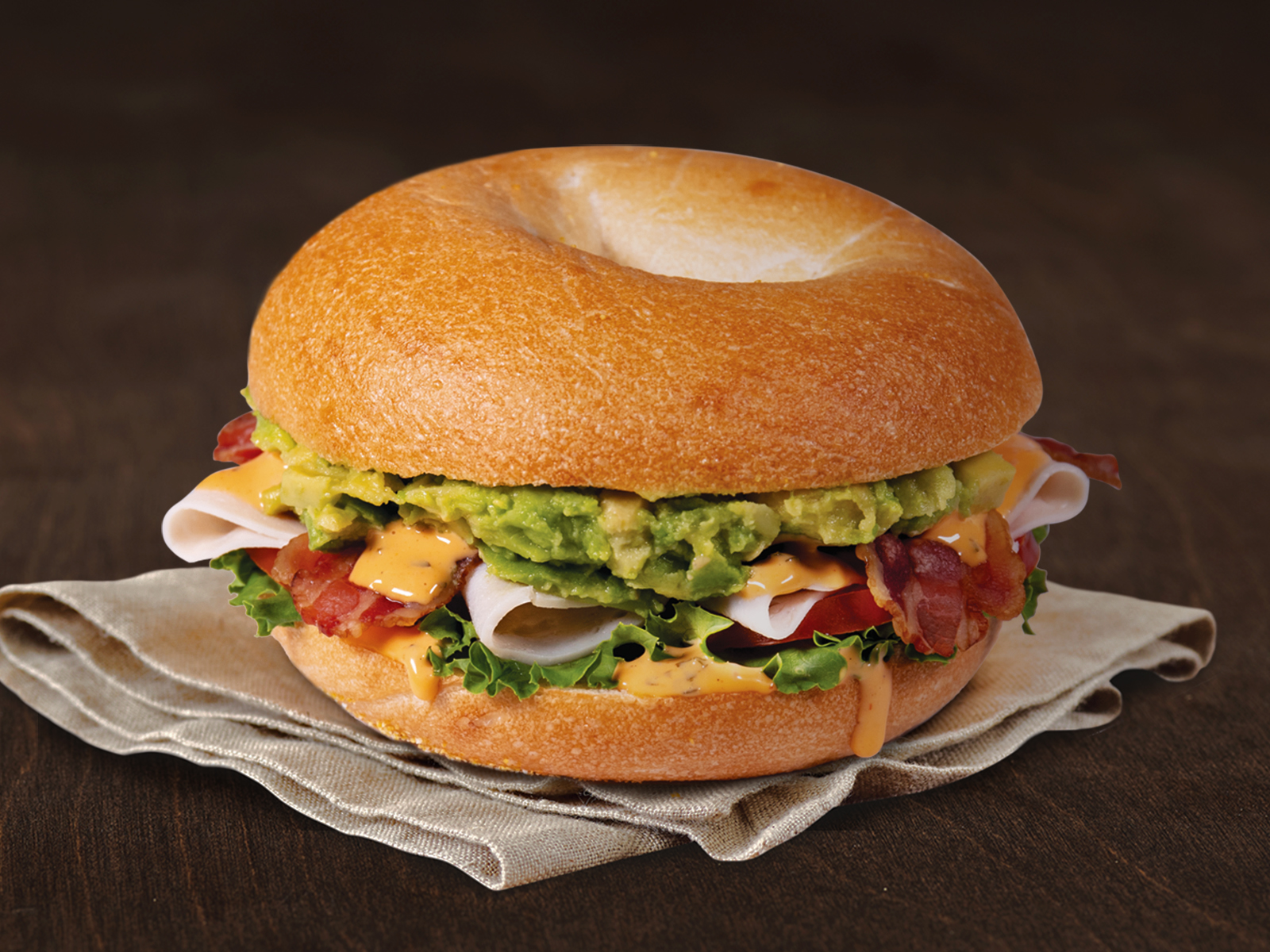 Order Turkey, Bacon & Avocado Sandwich food online from Einstein Bros. Bagels store, Atlanta on bringmethat.com
