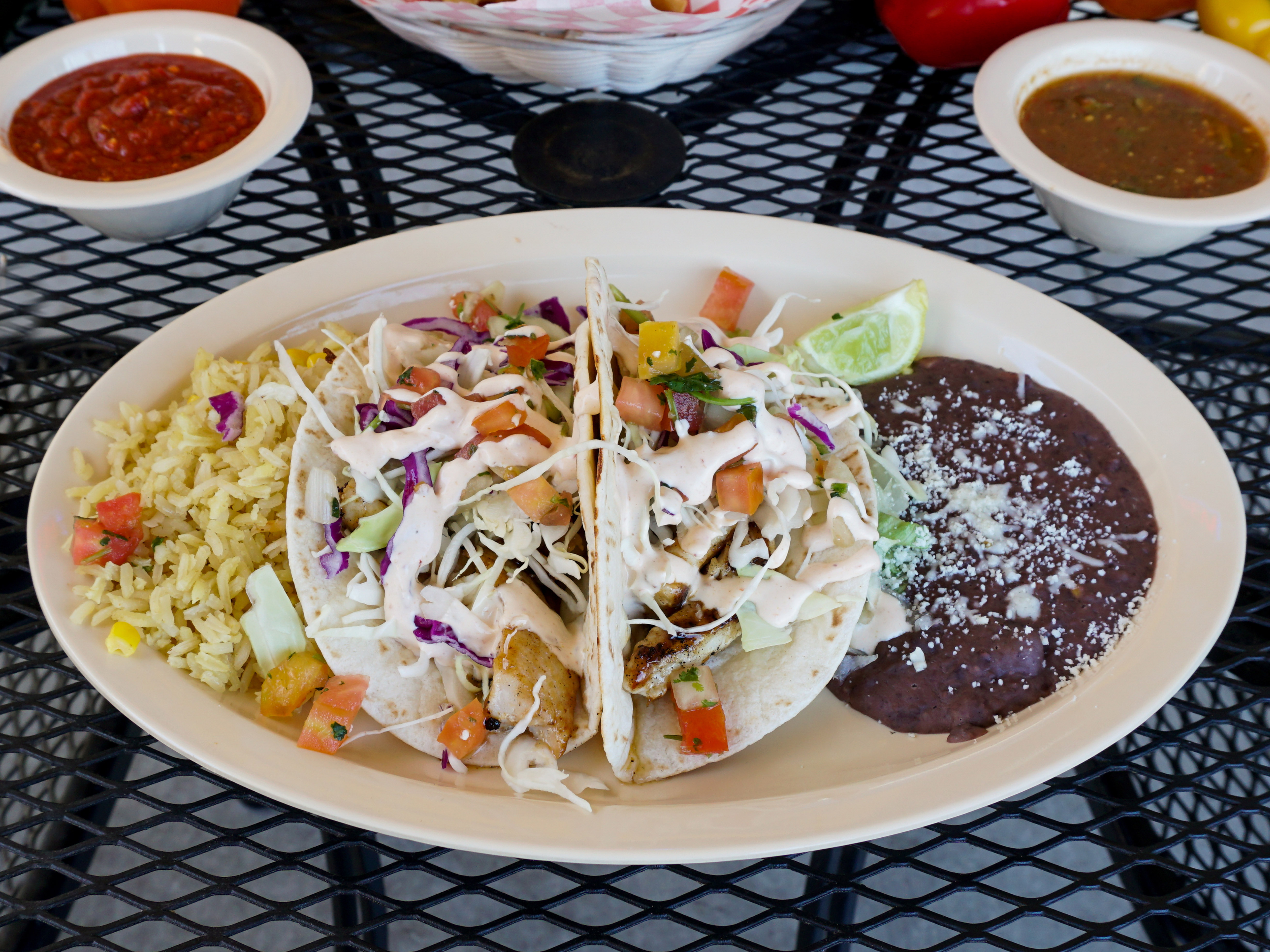 Order 4. Two Grilled Fish Tacos Combo food online from Mi Ranchito Mexican Restaurant store, San Diego on bringmethat.com