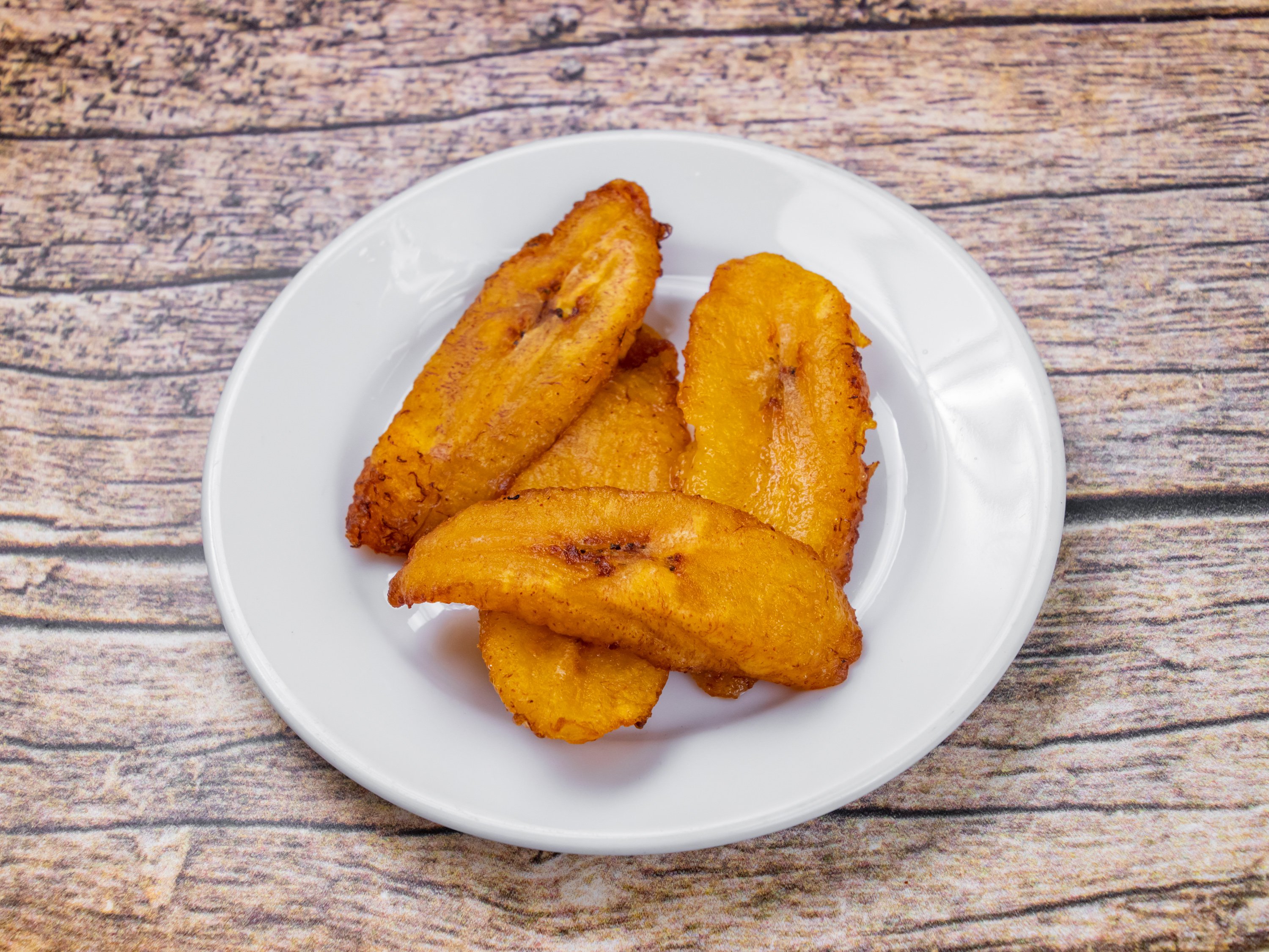Order Fried Plantains food online from Lyons Jamaican Cuisine Llc store, Norcross on bringmethat.com