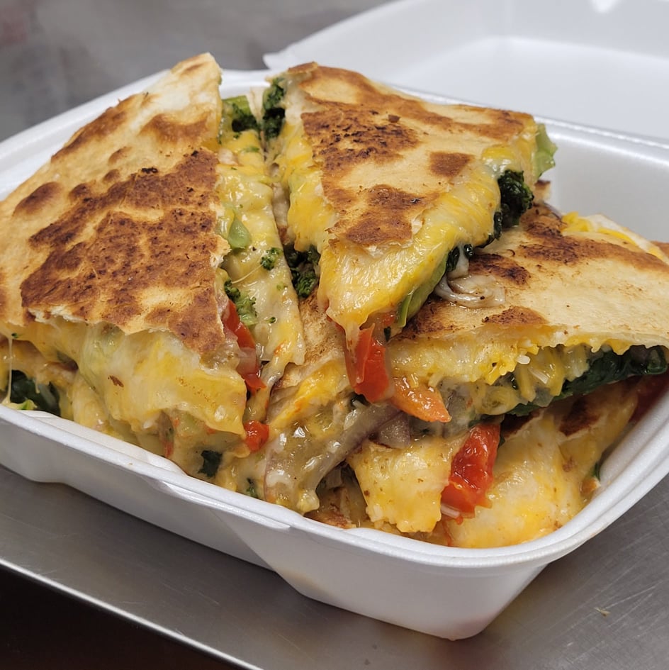 Order Veggie Quesadilla  With onion, pepper, spinach, broccoli, tomato, and cheddar. served with sour cream and salsa food online from Ria's Quesadillas store, Schenectady on bringmethat.com