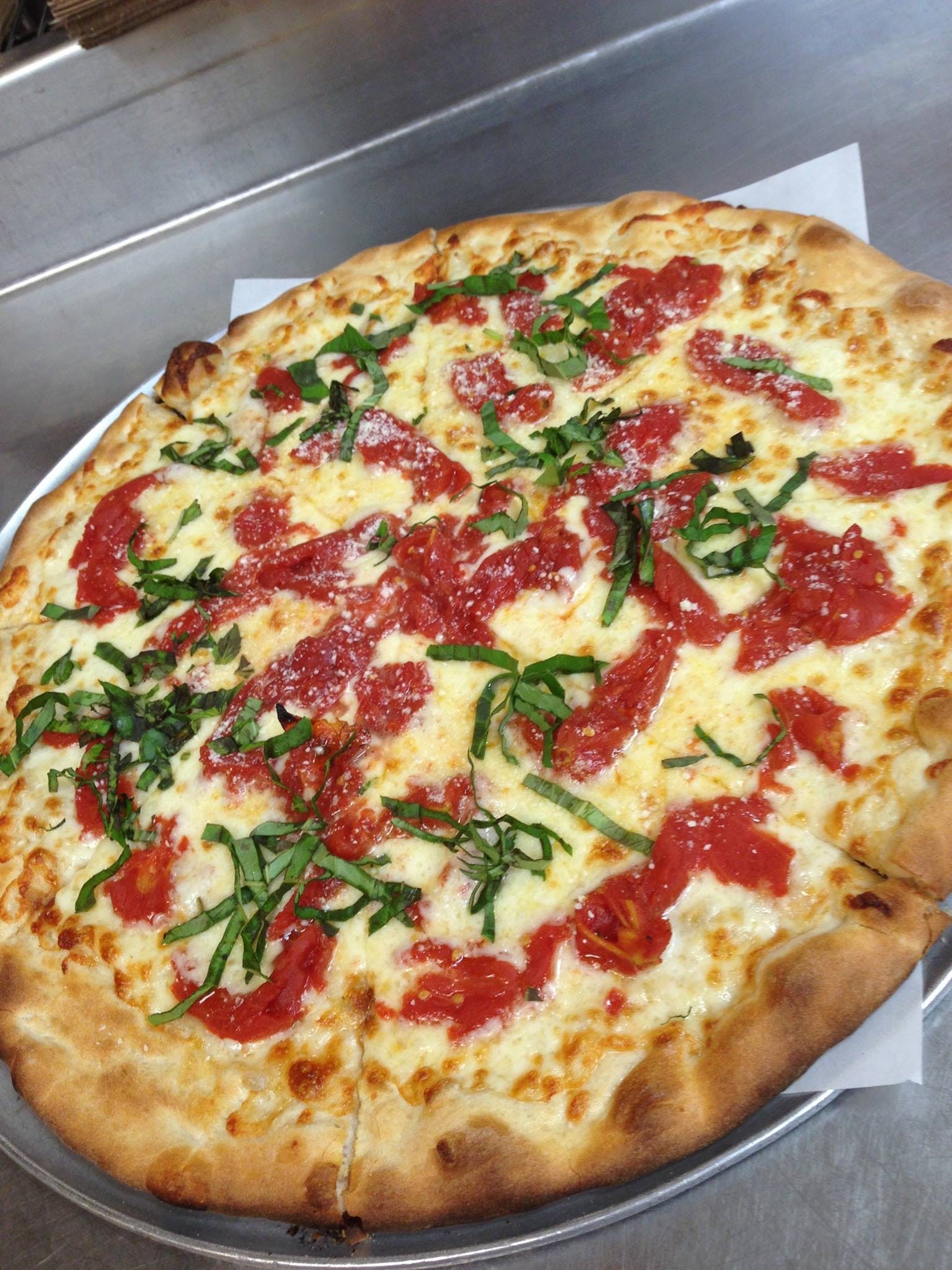 Order Classic Margarita Pizza - Small 12" food online from Outpost Pizza Of Westport store, Westport on bringmethat.com