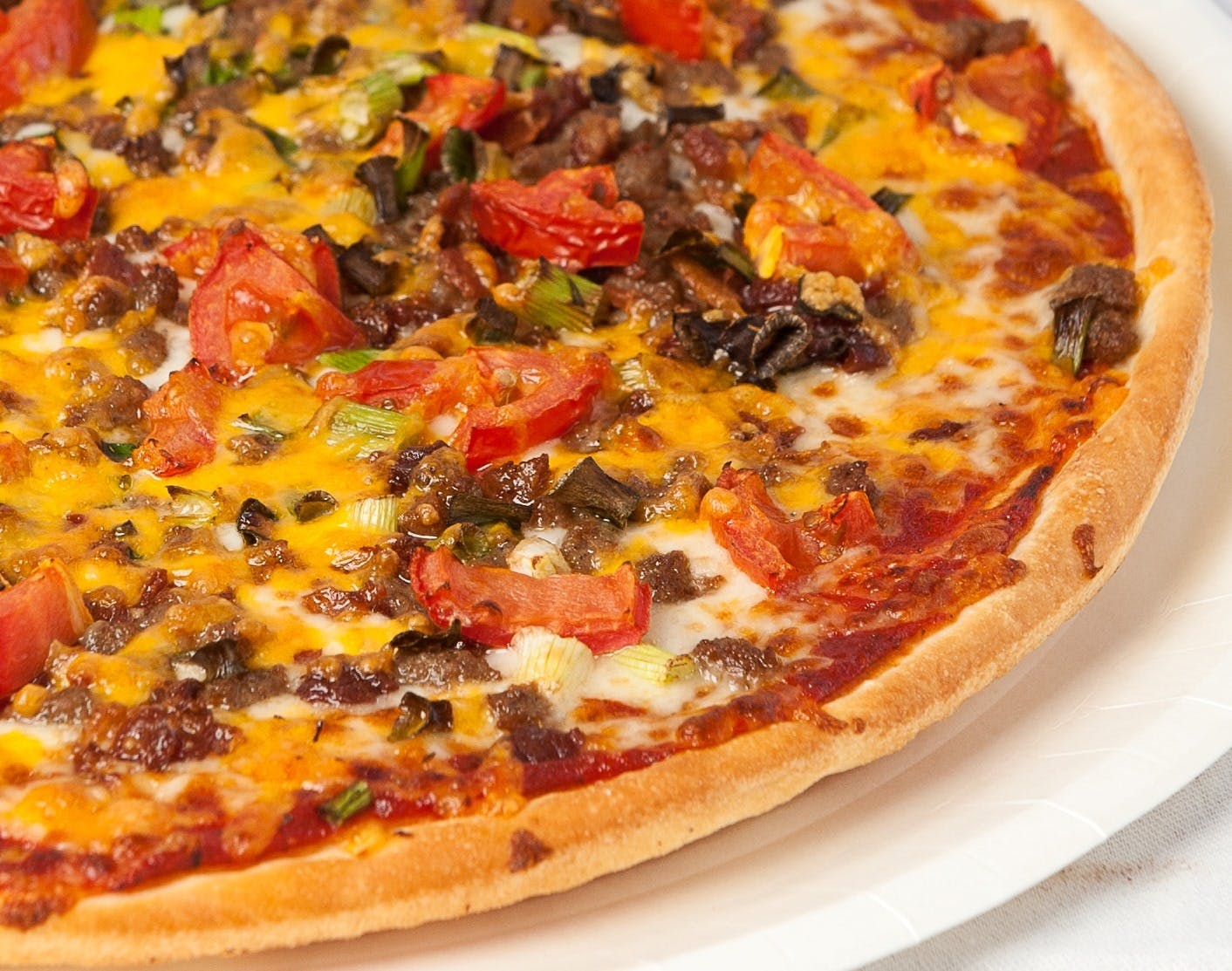 Order Bacon Cheeseburger Pizza - Small 10" food online from Pizzoli Pizza store, Washington on bringmethat.com