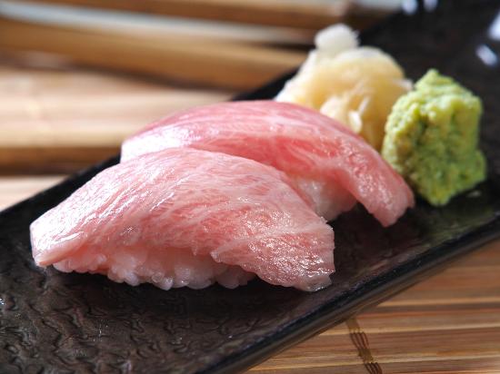 Order 2 Pieces Blue Fin Tuna O toro food online from Naked Fish Japanese Restaurant store, Chino Hills on bringmethat.com
