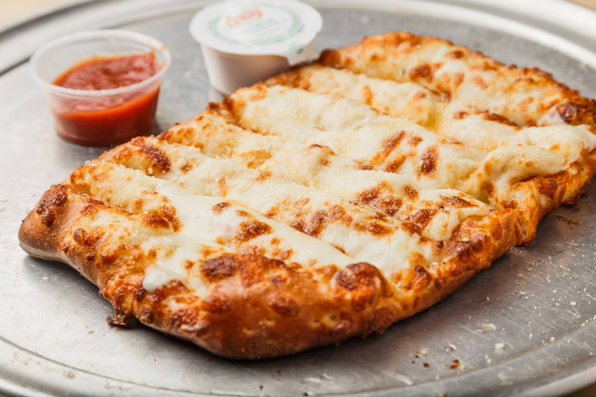Order Cheesy Bread - Small (8 Pieces) food online from Zoners Pizza Wings & Waffles store, Statesboro on bringmethat.com