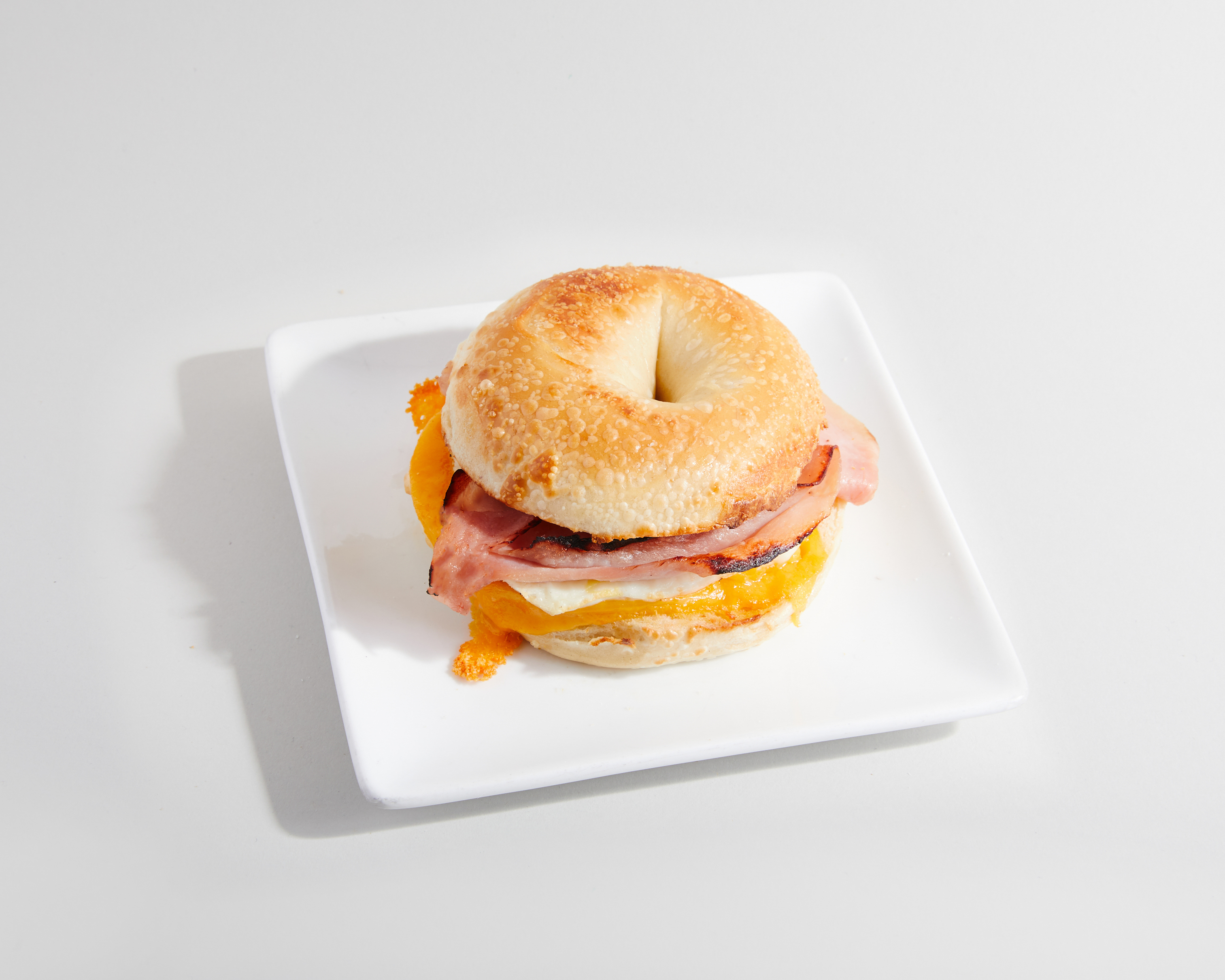 Order Bagel Sandwich - Ham, Egg & Cheese food online from Sweetwaters Coffee & Tea store, Columbus on bringmethat.com