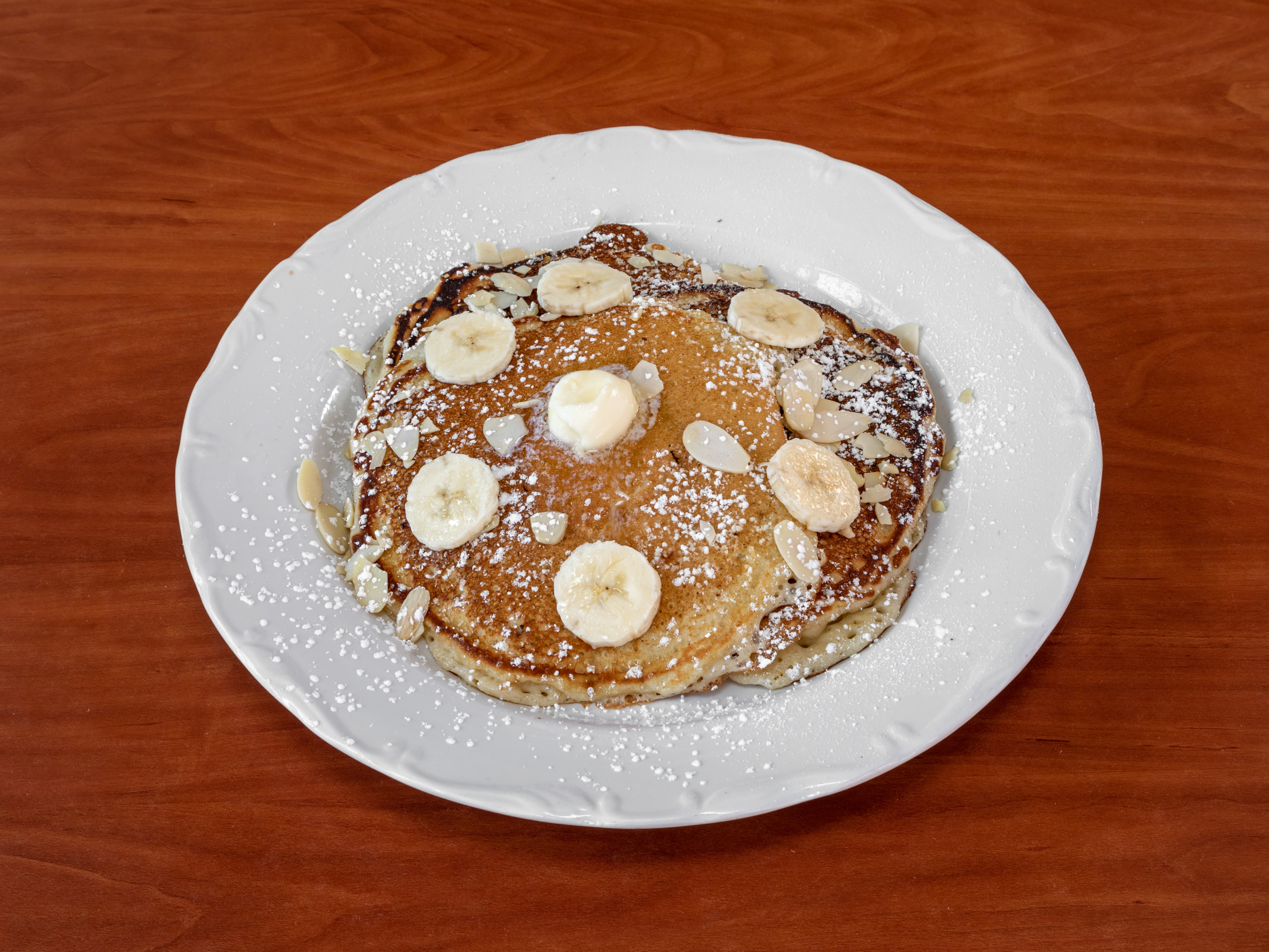 Order Banana and Almond Pancakes food online from Melrose Kitchen store, Phoenix on bringmethat.com