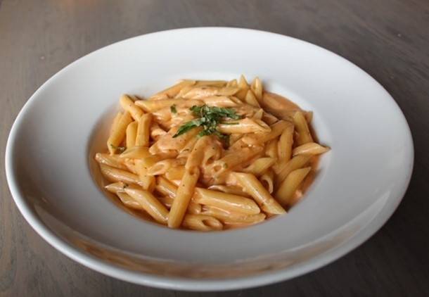 Order Penne with Tomato Cream* food online from Uccello Ristorante store, Grand Rapids on bringmethat.com