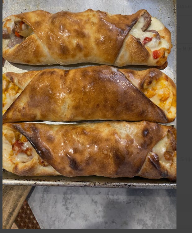 Order Meat Calzone - Calzone food online from Flames Woodfire Pizza store, Elmsford on bringmethat.com