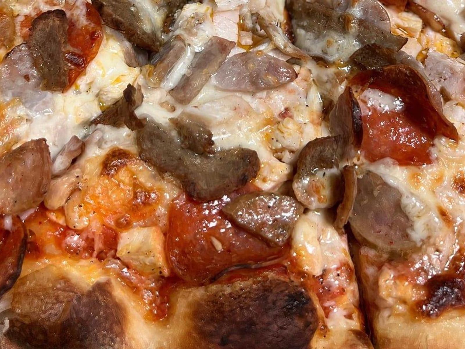 Order #7 Meat Lovers food online from Lisa's Family Pizzeria store, Wakefield on bringmethat.com