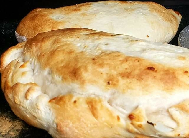 Order Oven-Baked Calzone food online from Marios store, Dubuque on bringmethat.com