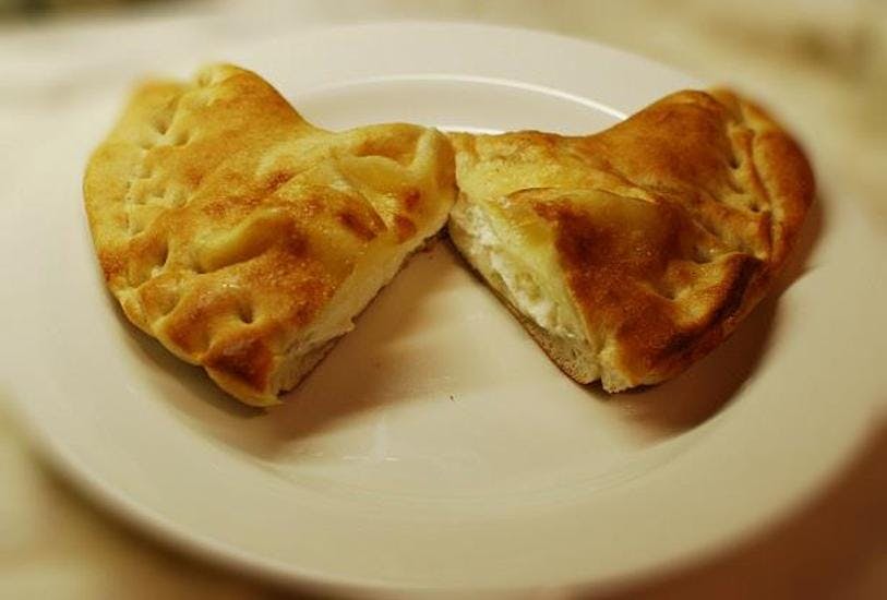 Order Calzone - Calzone food online from Neels Pizza and Pasta store, Queens on bringmethat.com