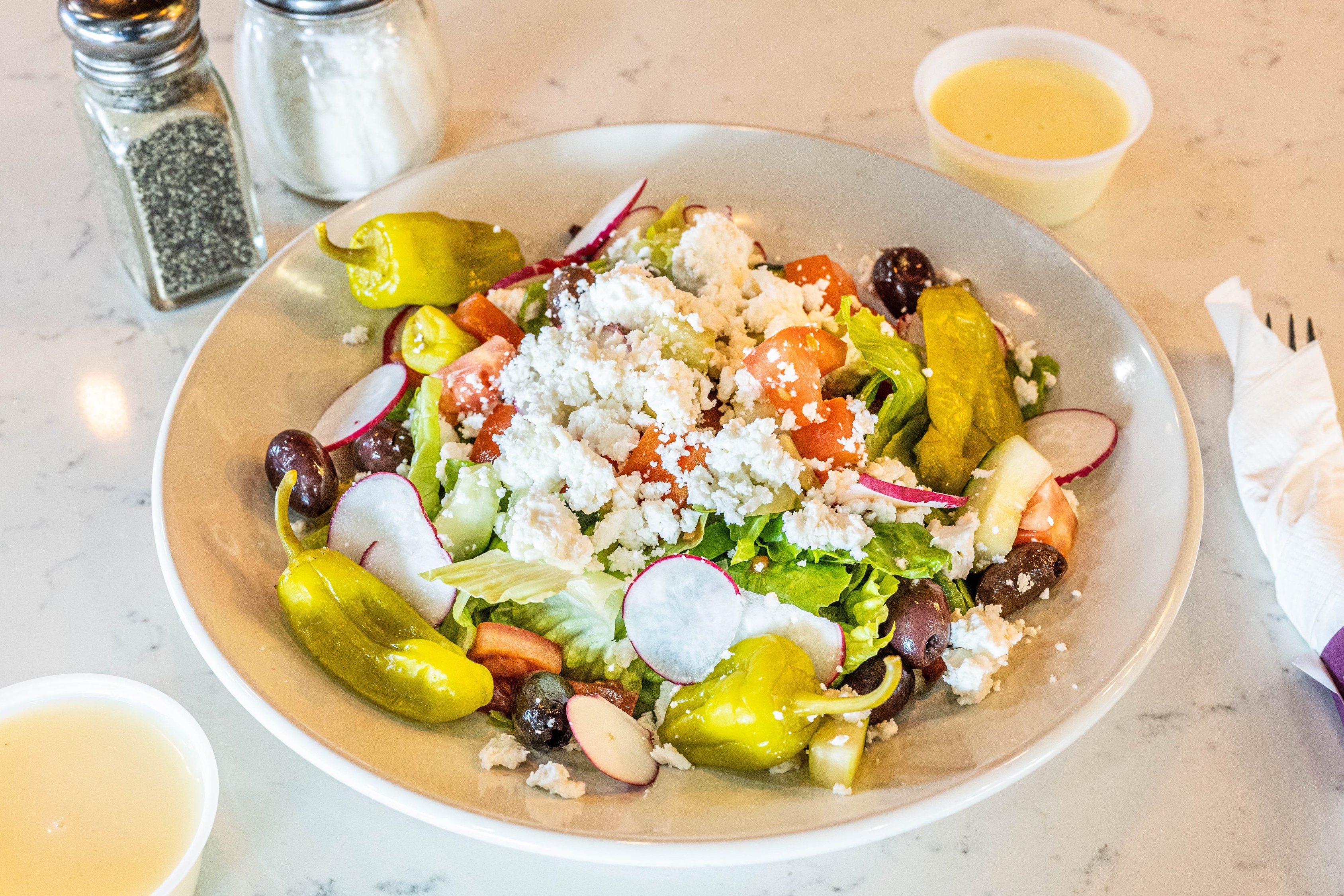 Order Greek Salad food online from Romans Pizza House store, Absecon on bringmethat.com