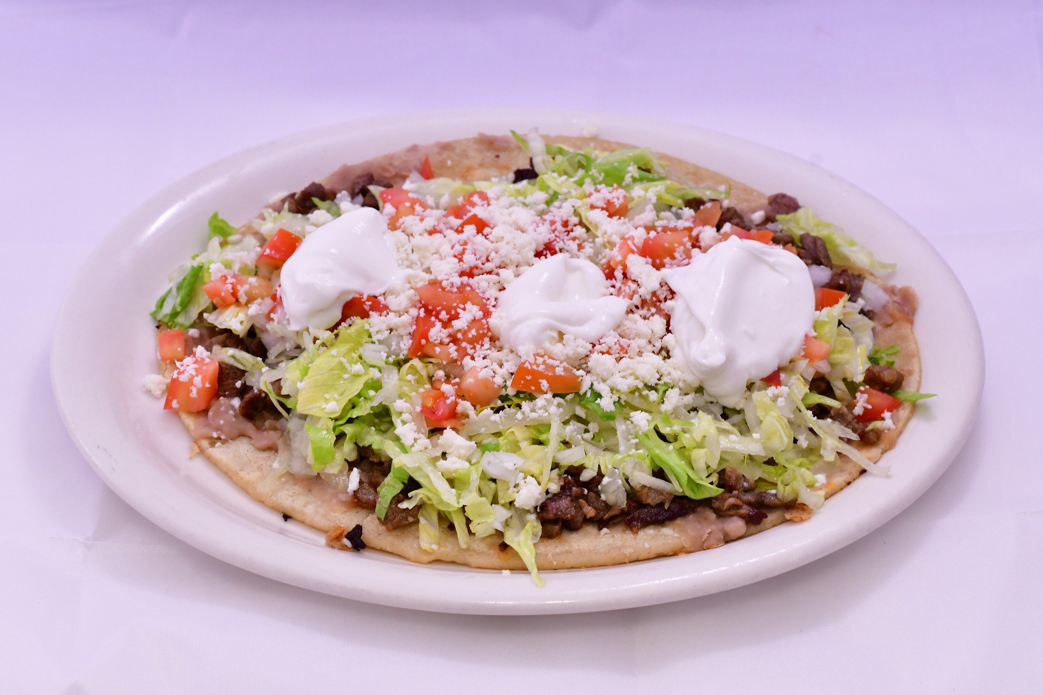 Order Huarache food online from Tierra Caliente Restaurant store, Chicago on bringmethat.com
