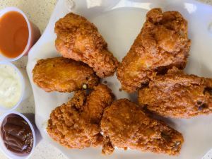 Order  6 Hot Wings food online from Charo Chicken store, Huntington Beach on bringmethat.com
