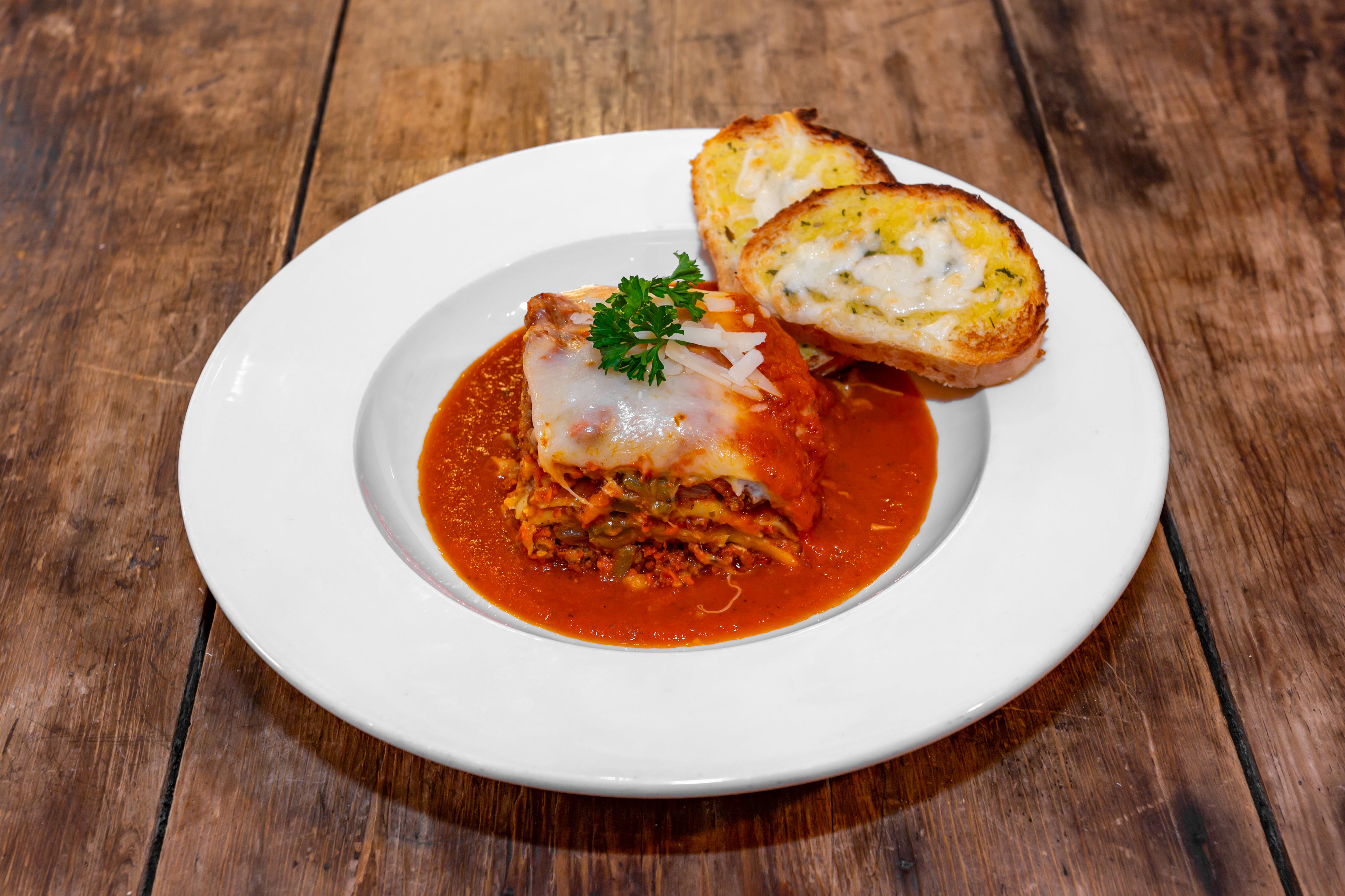 Order Lasagna - Entrees food online from Cafe Galleria store, Midway on bringmethat.com