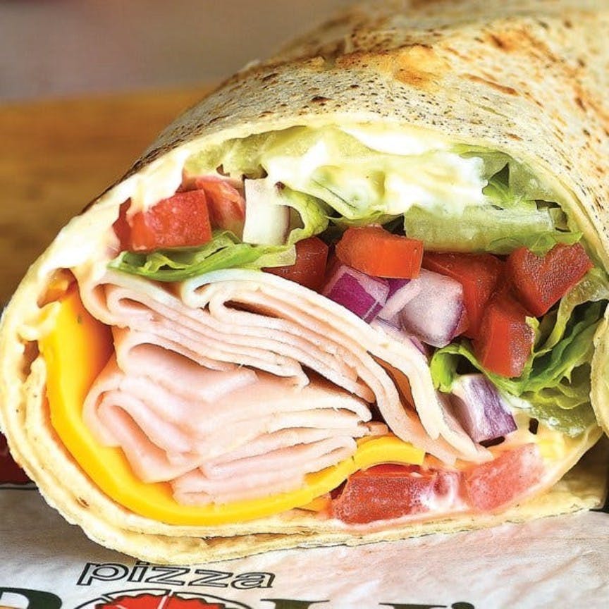 Order Sliced Turkey Wrap - Wrap food online from Pizza Boli's store, Baltimore on bringmethat.com