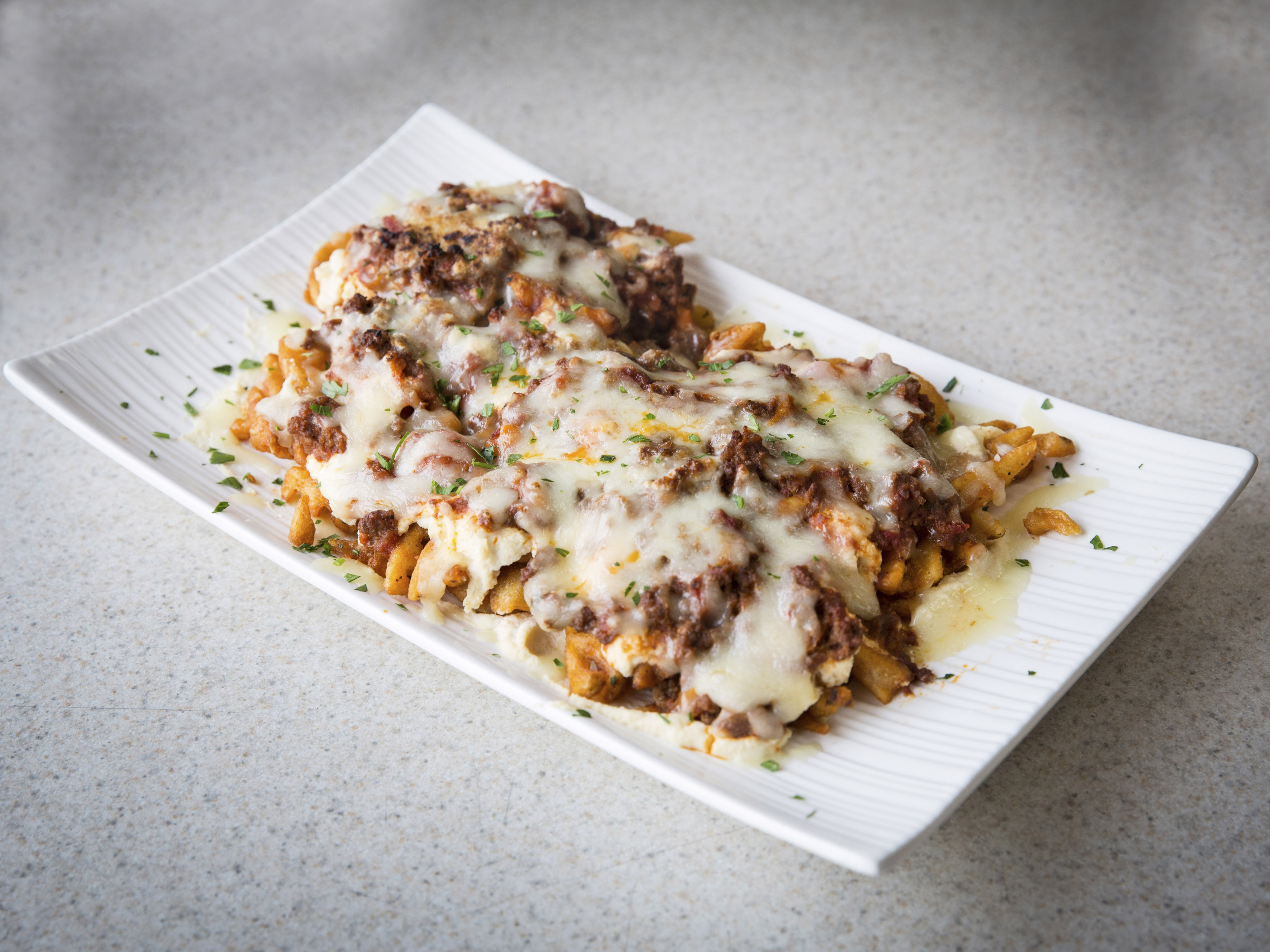 Order Lasagna Waffle Fries food online from Constantine's Delicatessen store, Bayside on bringmethat.com