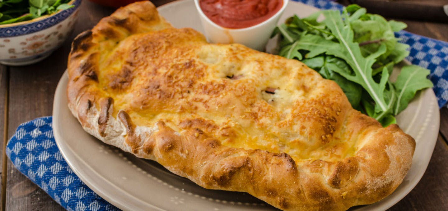 Order Calzone - Small food online from Poppy's Pizzeria store, Langhorne on bringmethat.com