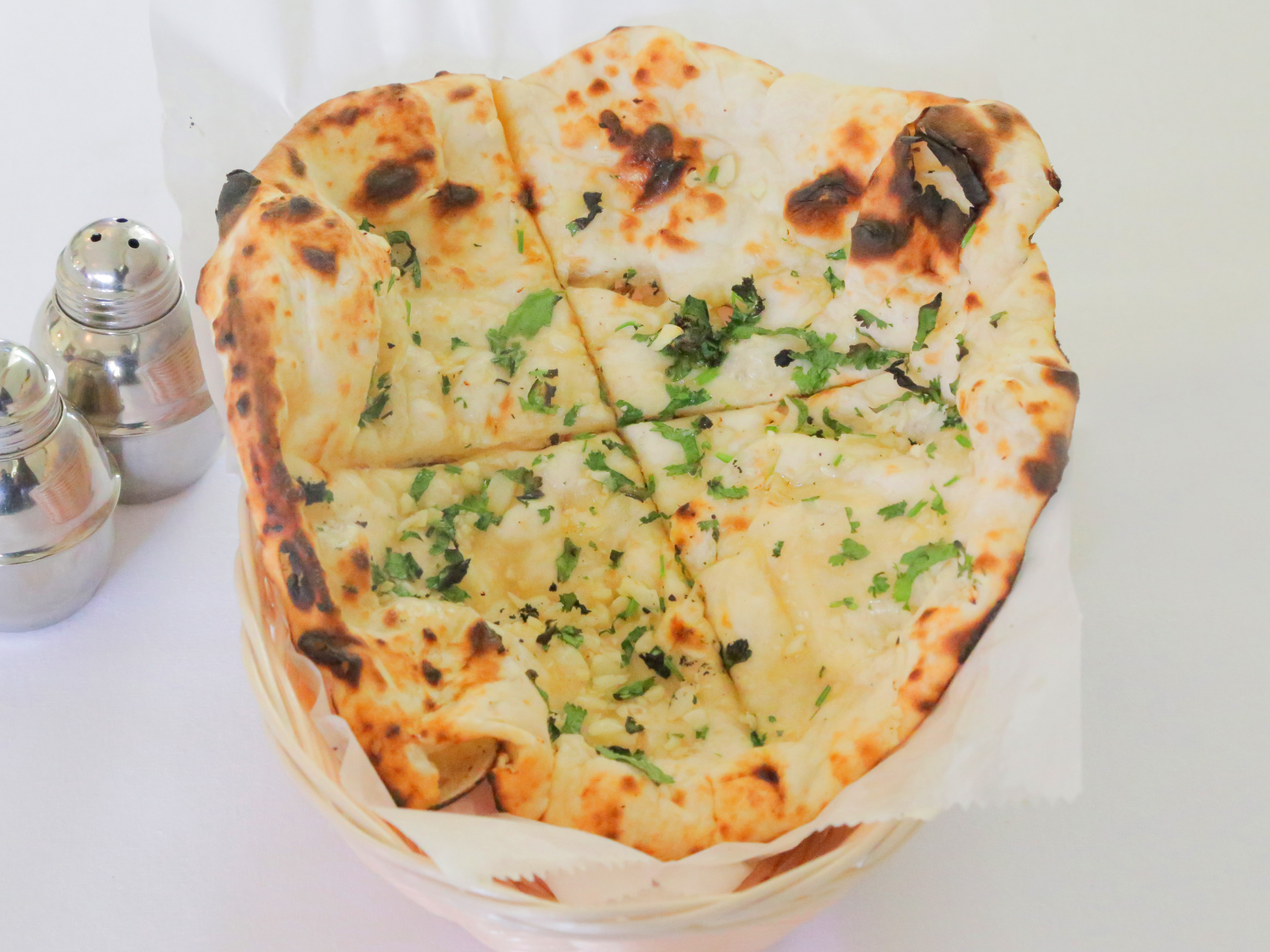 Order Garlic Naan food online from Shan-A-Punjab store, Brookline on bringmethat.com
