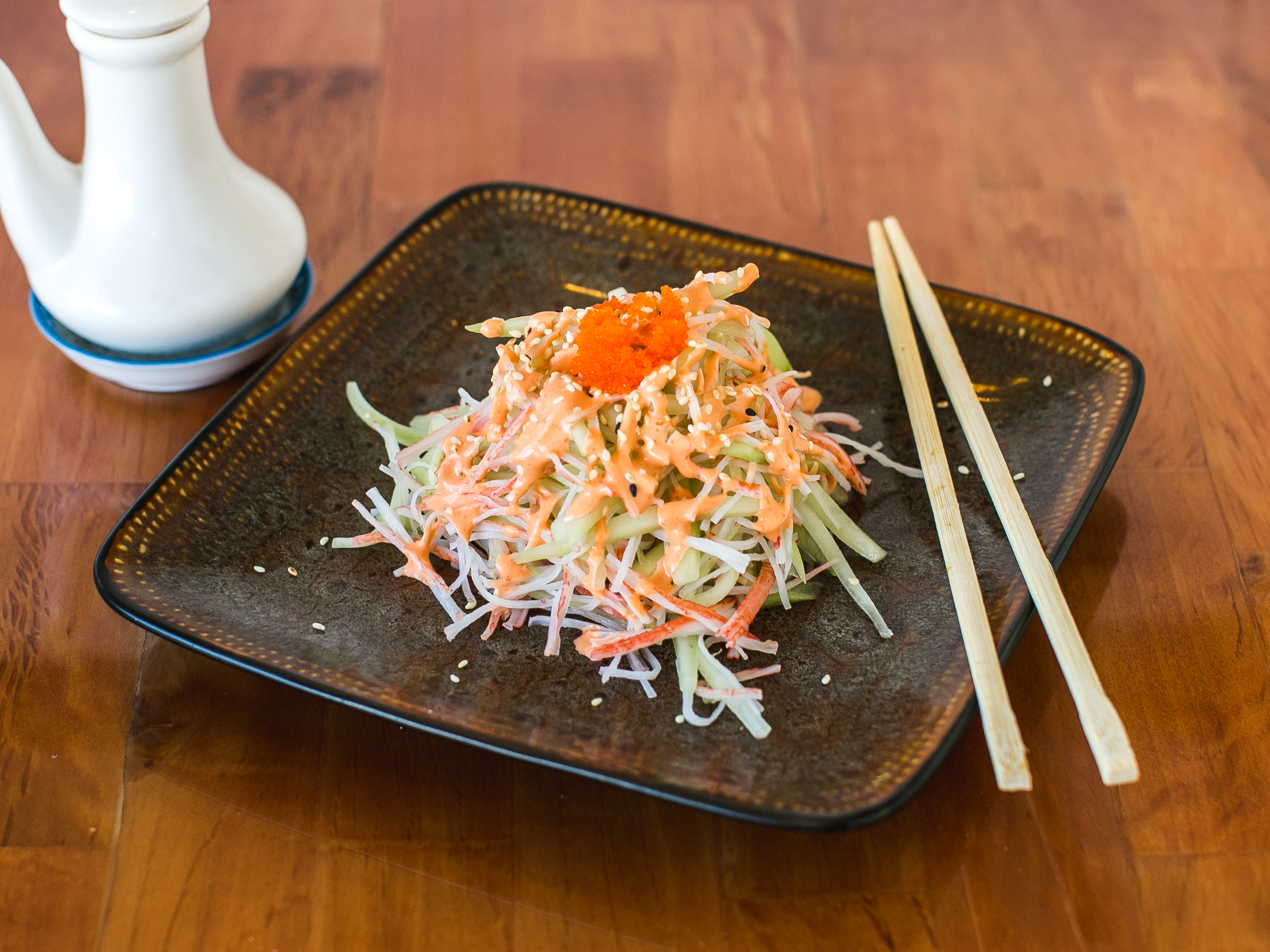 Order J24. Spicy Kani Salad food online from Hewa Japanese Restaurant, Stratford Center store, Stratford on bringmethat.com