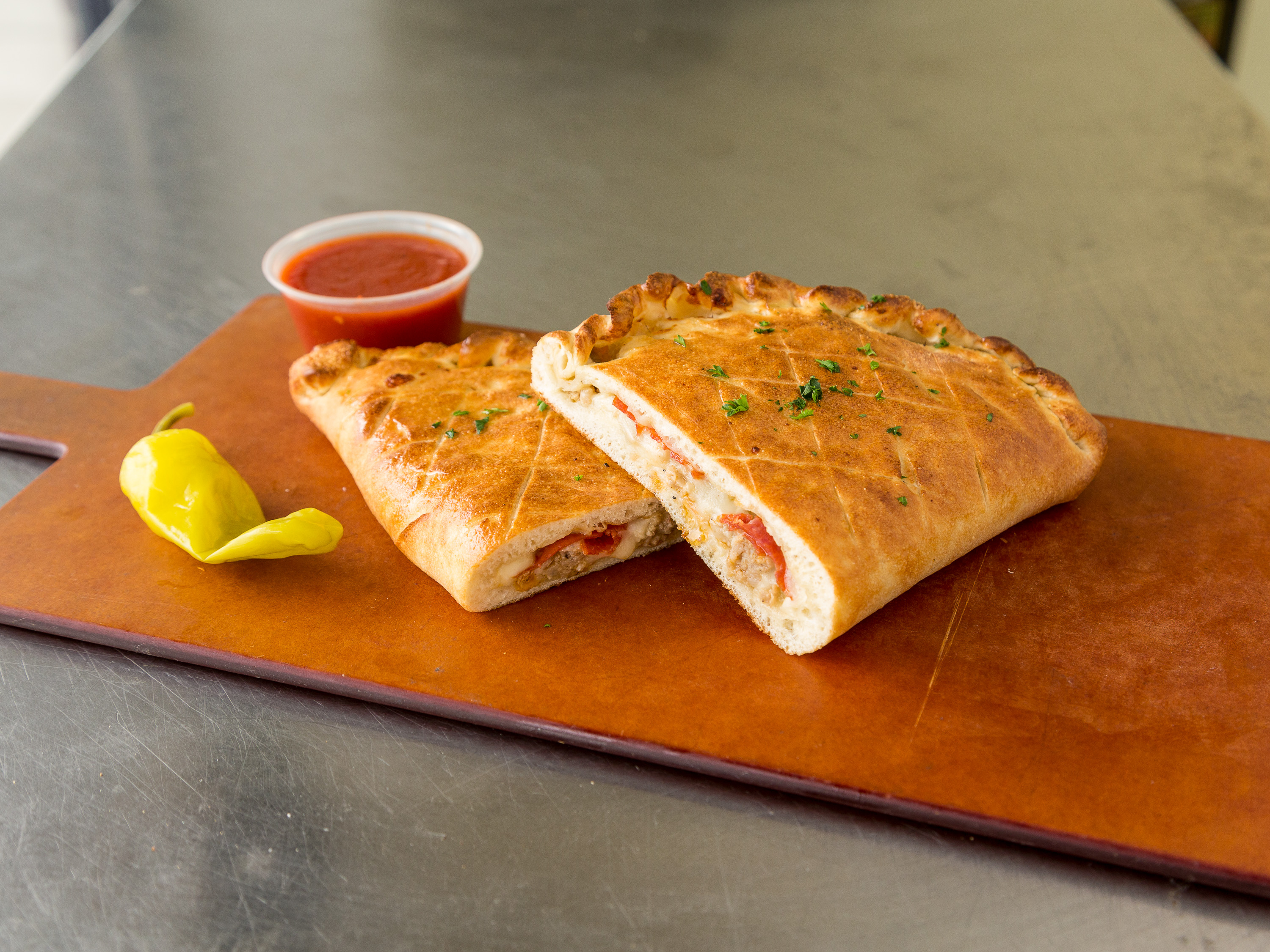 Order Specialty Calzone food online from Revolution Pizza store, Willowick on bringmethat.com