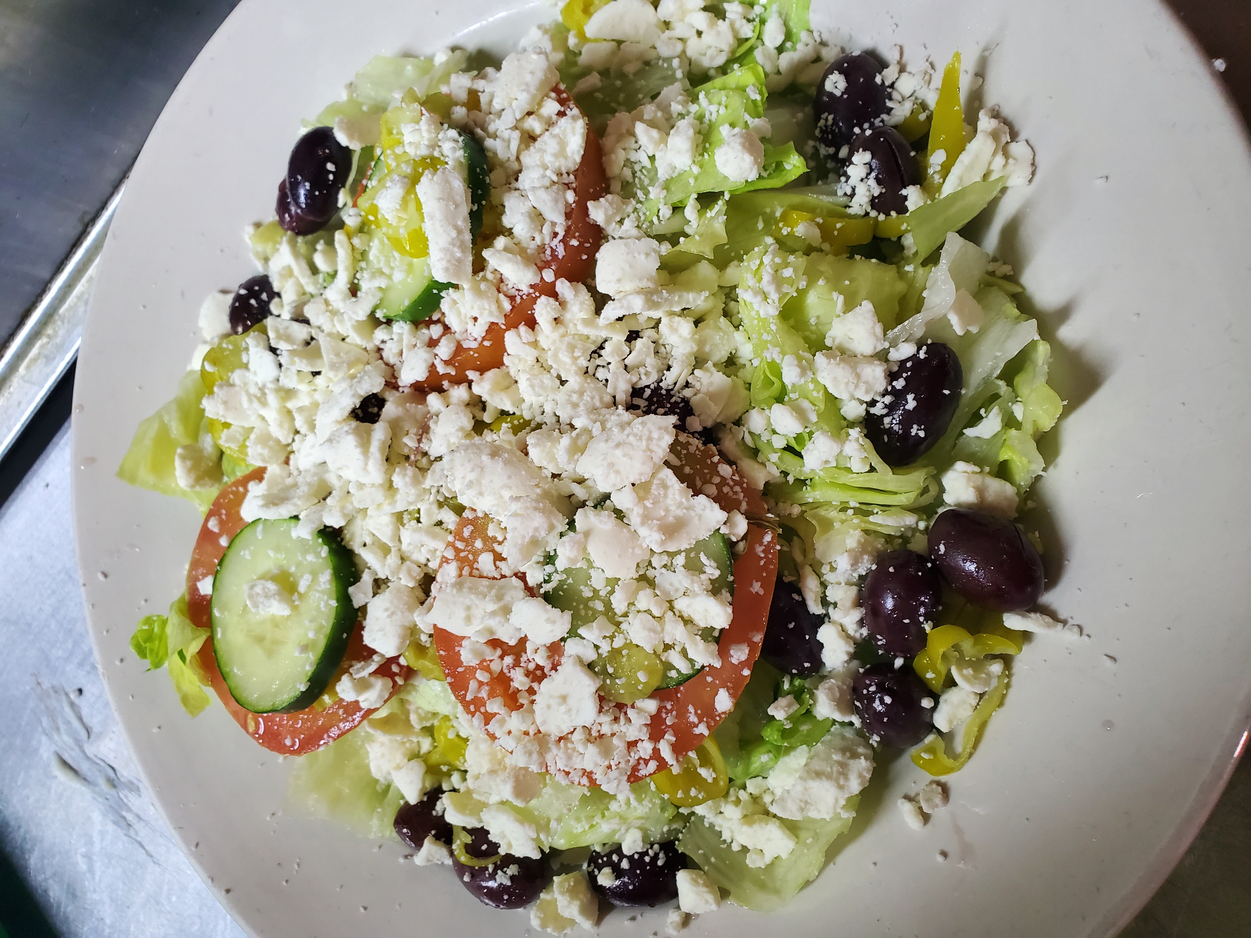 Order Greek Salad food online from Pepes Pizza store, North Richland Hills on bringmethat.com