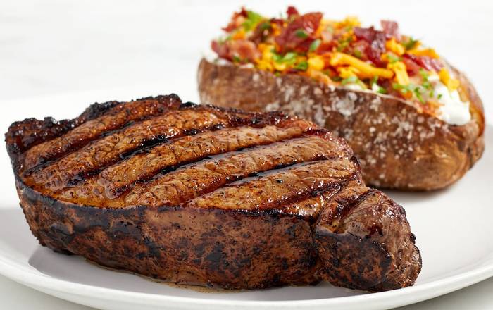 Order Wood Grilled NY Strip* food online from Firebirds Wood Fired Grill store, Omaha on bringmethat.com