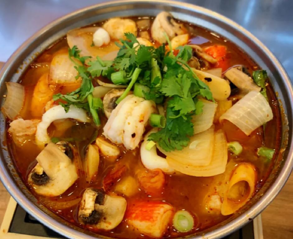 Order 18. Large Tom Yum Seafood Soup food online from Am Thai Fusion Cuisine store, Anaheim on bringmethat.com