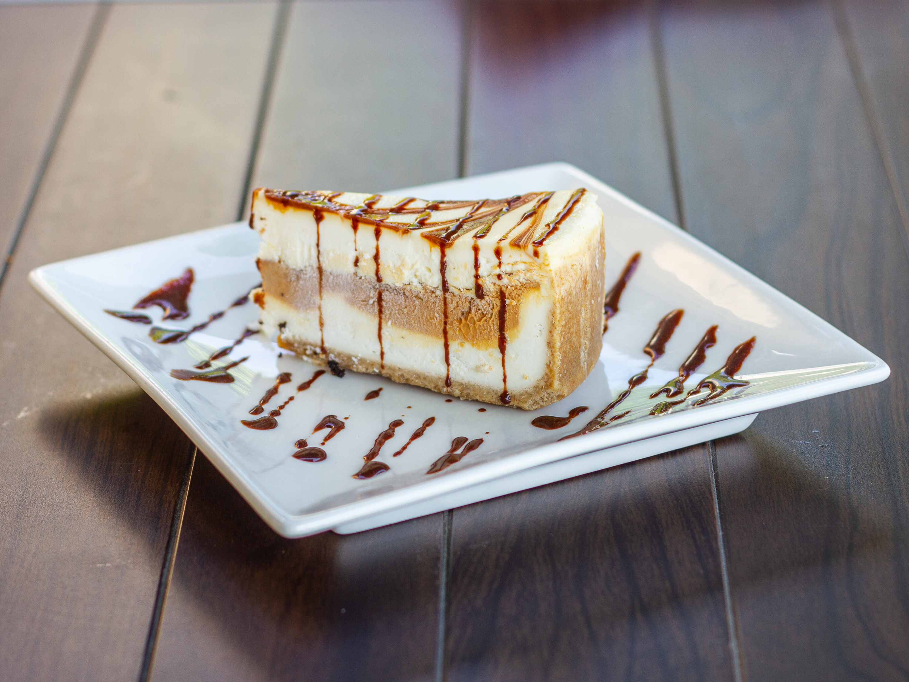 Order Dulce de Leche Cheesecake food online from Flaming Wings store, Glendale on bringmethat.com