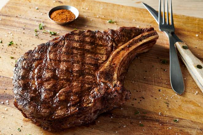 Order Bone-In Ribeye* 18 oz. food online from Outback Steakhouse store, Buena Park on bringmethat.com