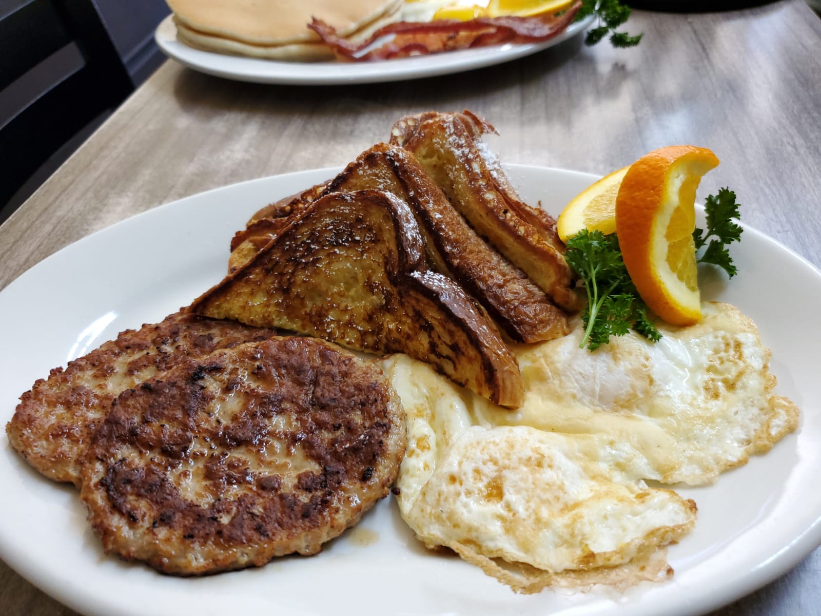 Order (2) French toast, (2) eggs & (2) bacon food online from Monte Carlo Cafe store, Los Angeles on bringmethat.com