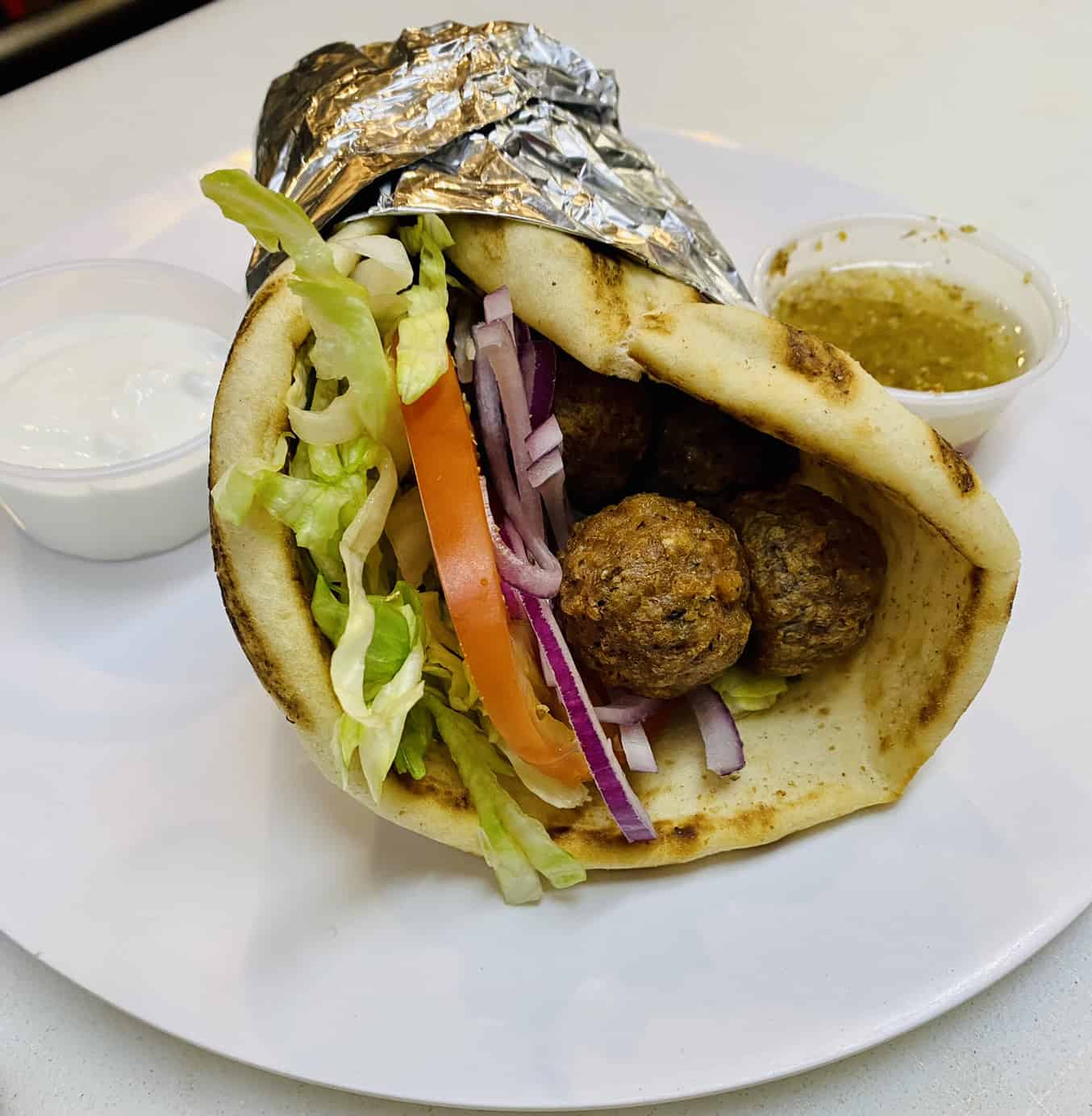 Order Vegan Gyro food online from Famous Pizza store, Paramus on bringmethat.com