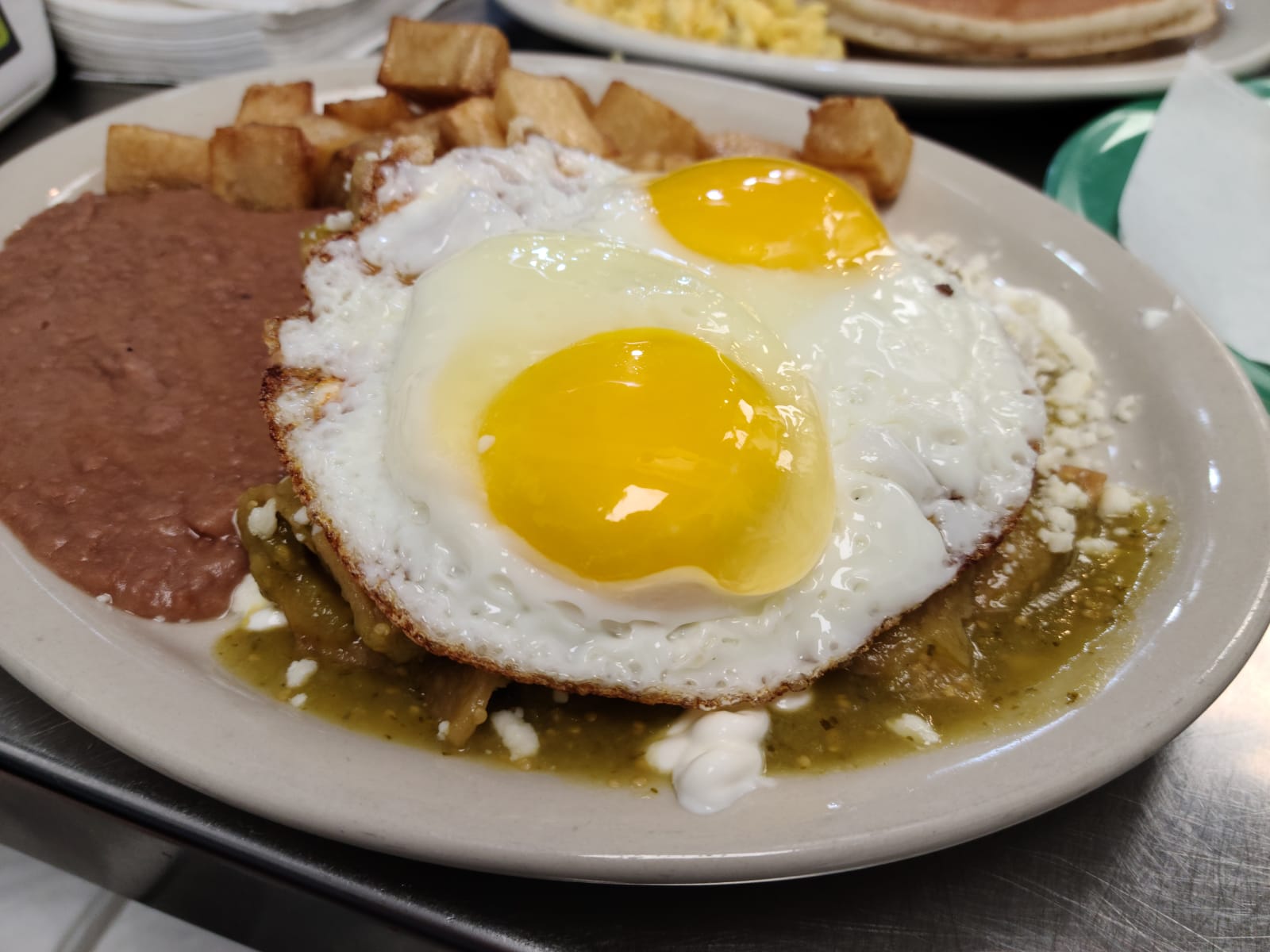 Order Chilaquiles with Eggs food online from Los Arcos Mexican Grill store, San Antonio on bringmethat.com