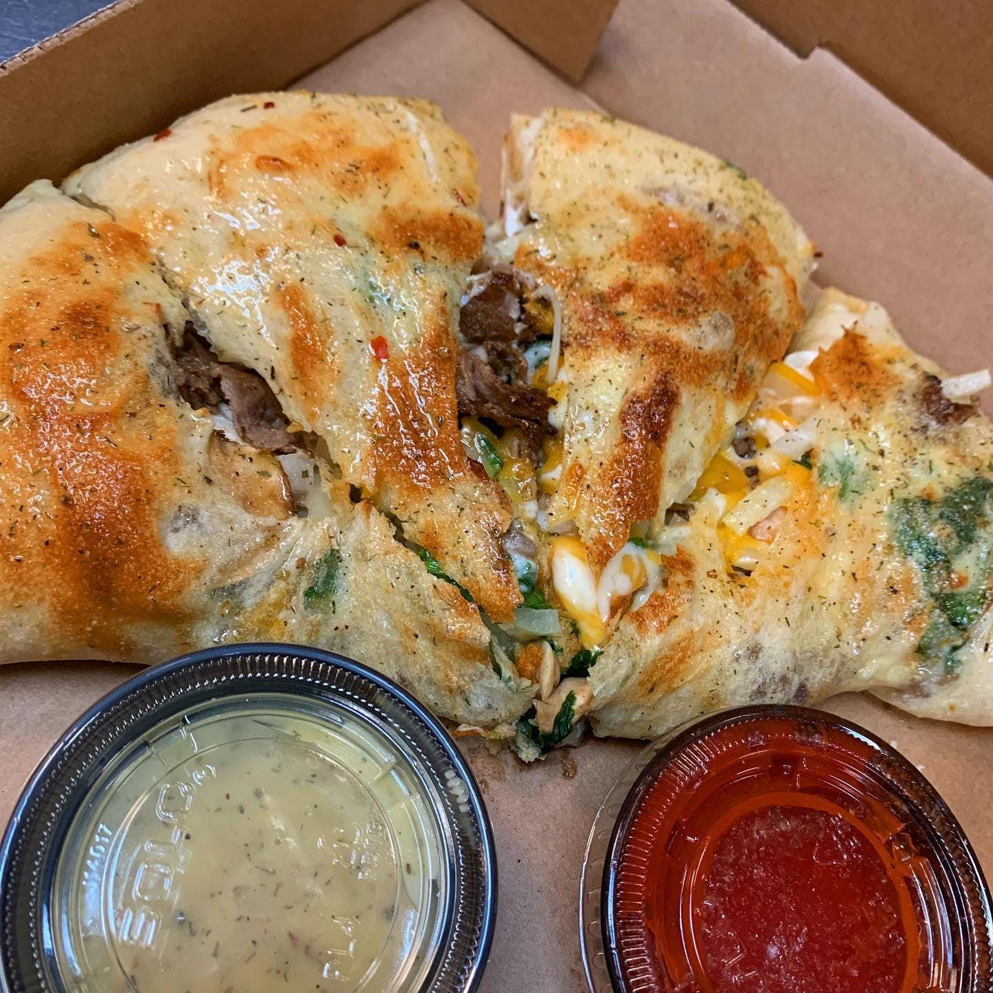 Order Calzone - Calzone food online from Holiday Pizza store, Statesboro on bringmethat.com