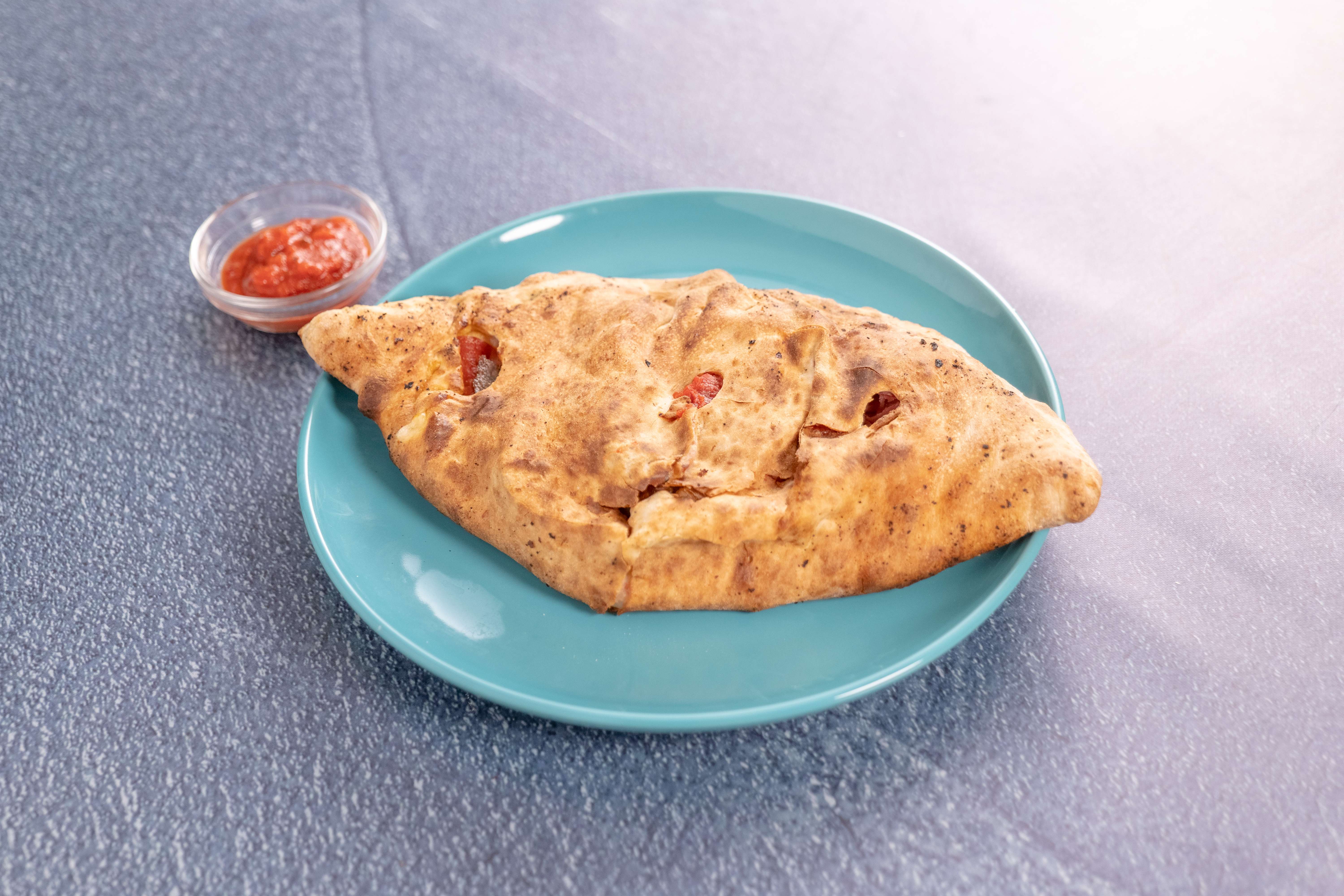 Order Meat Lovers Calzone food online from Vincenzo's Pizza Granada Hills store, Granada Hills on bringmethat.com