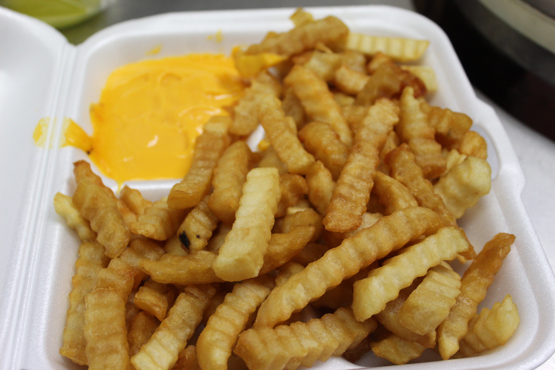 Order 77. French Fries with Cheese food online from Yummy Taco store, Inwood on bringmethat.com
