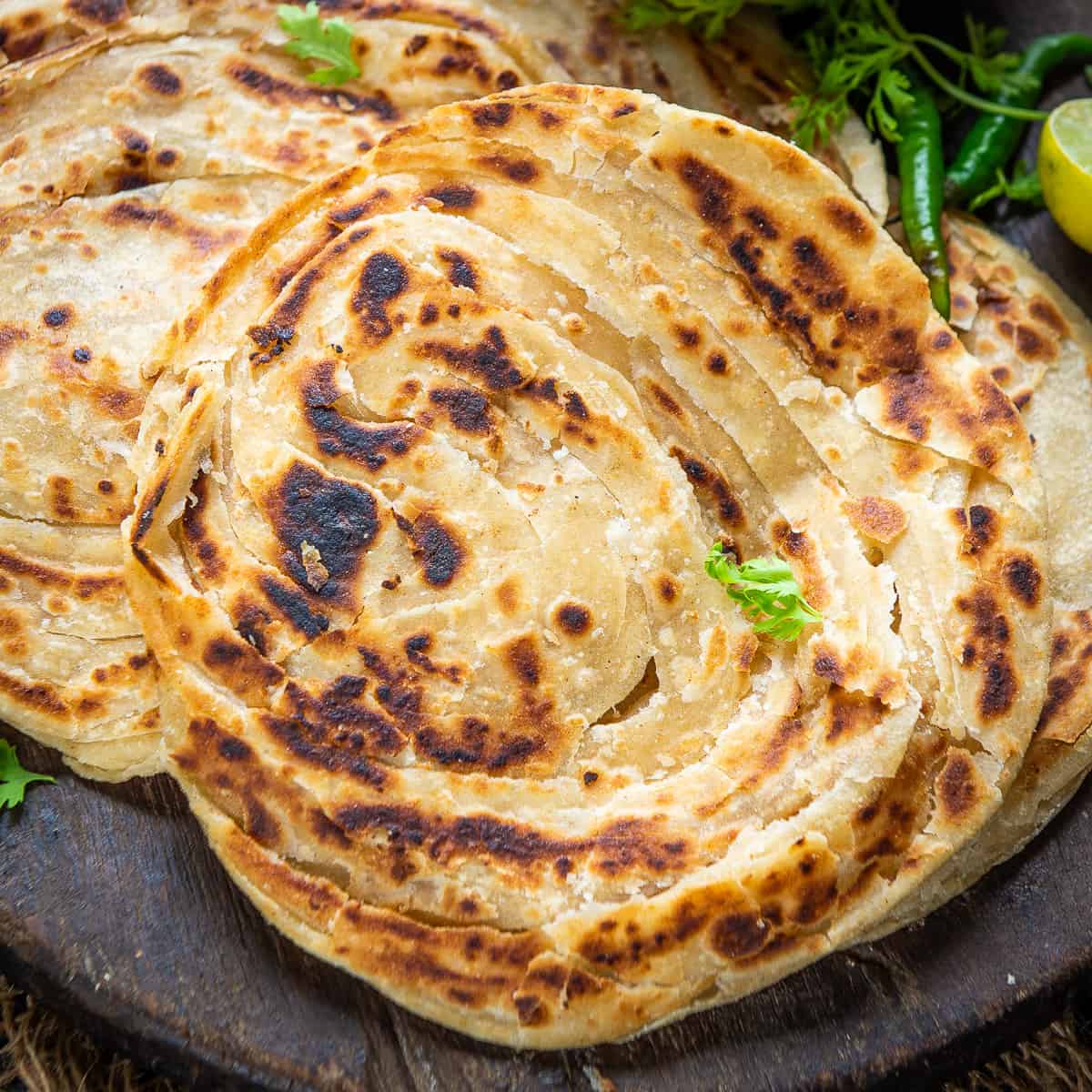 Order Lacha Paratha food online from Tamarind Indian Cuisine store, Sterling on bringmethat.com