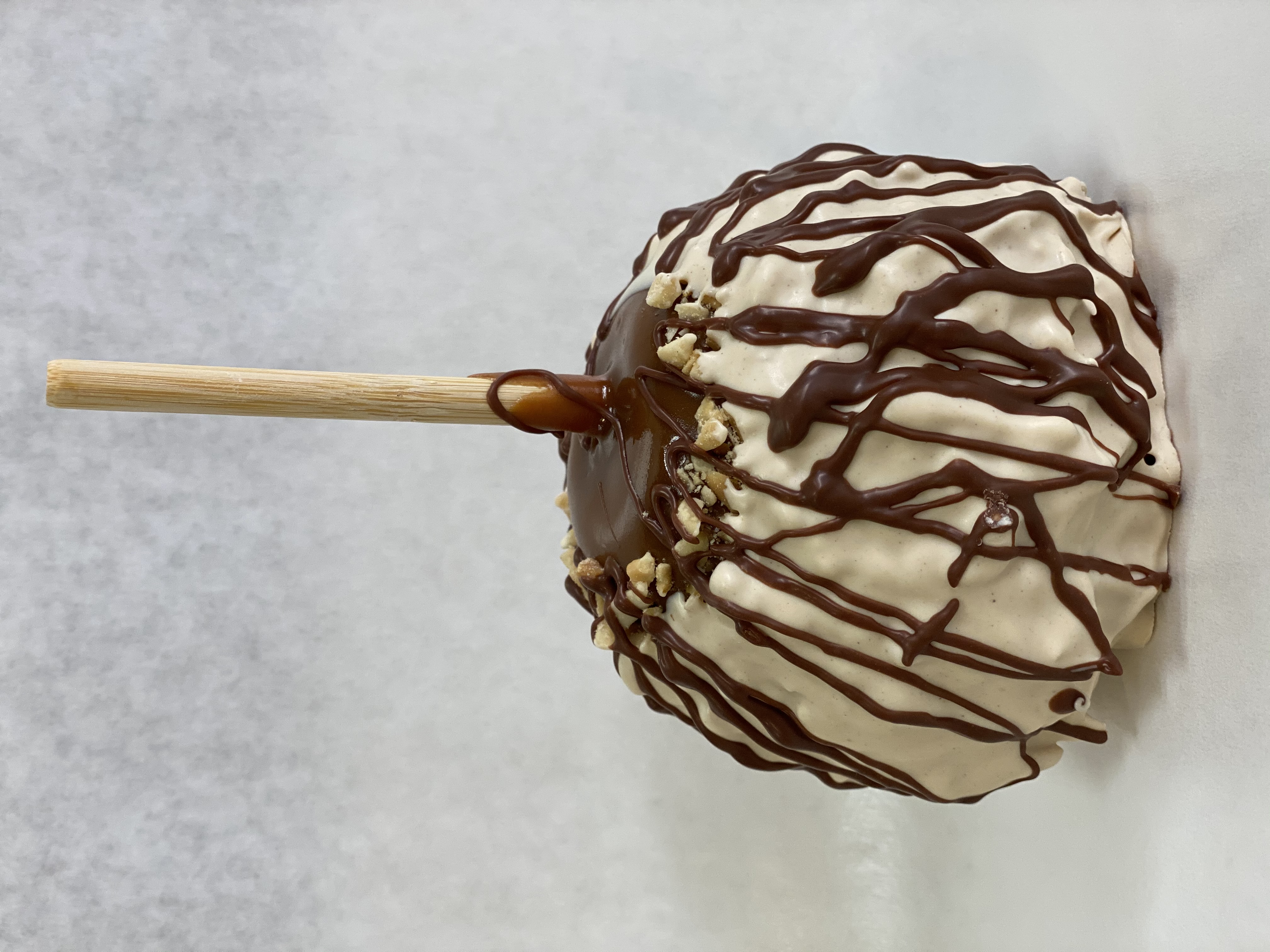 Order Tiger Butter Caramel Apple food online from Rocky Mountain Chocolate Factory store, Irvine on bringmethat.com