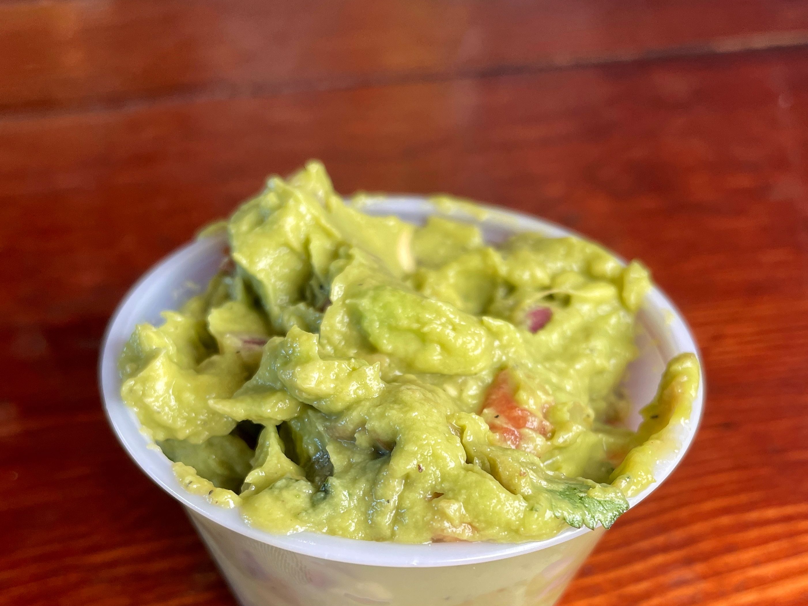Order Add Guac food online from Right Coast Taqueria store, Deer Park on bringmethat.com