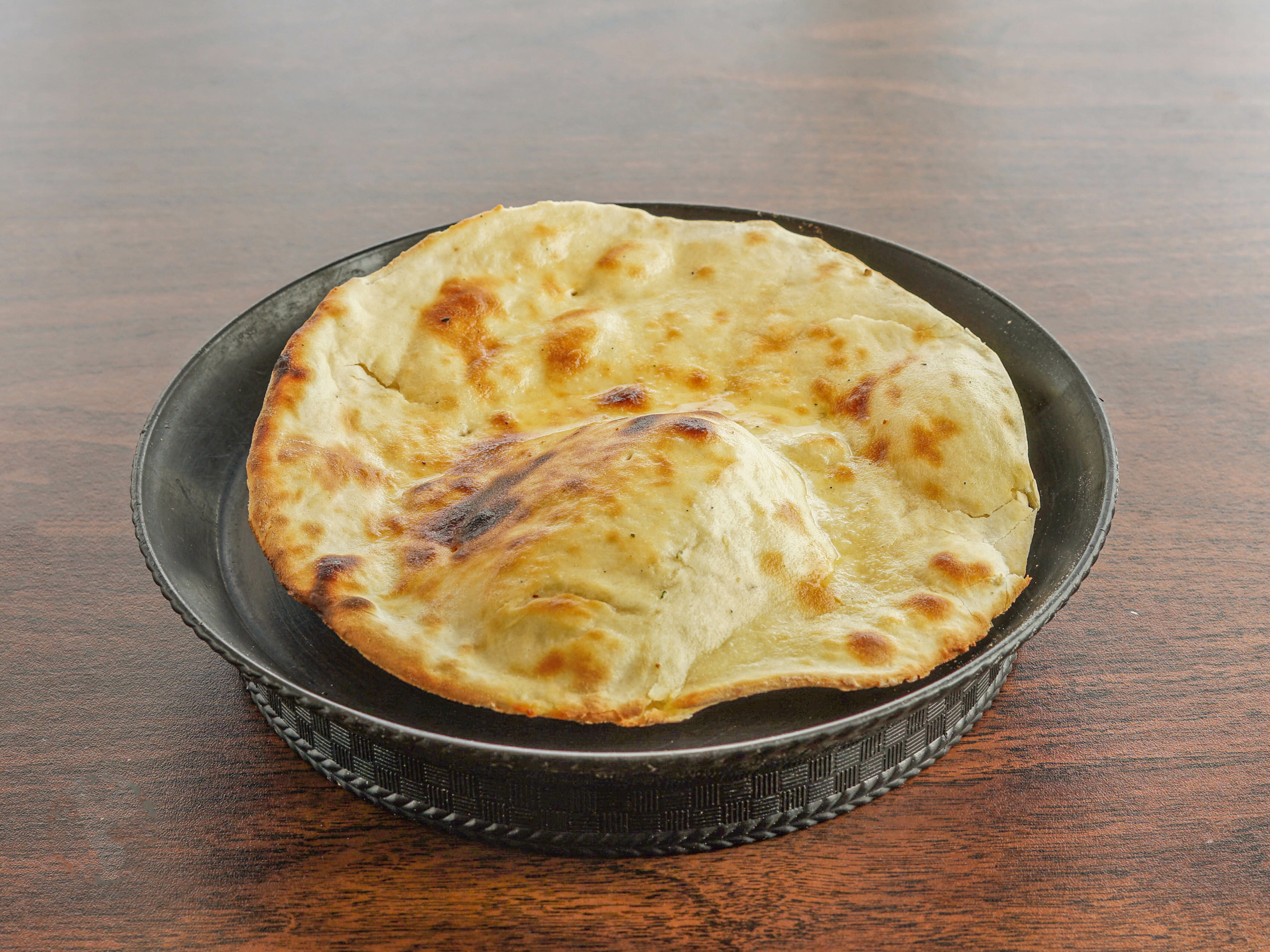 Order Tandoori Naan food online from Kitchen of India store, Parkville on bringmethat.com