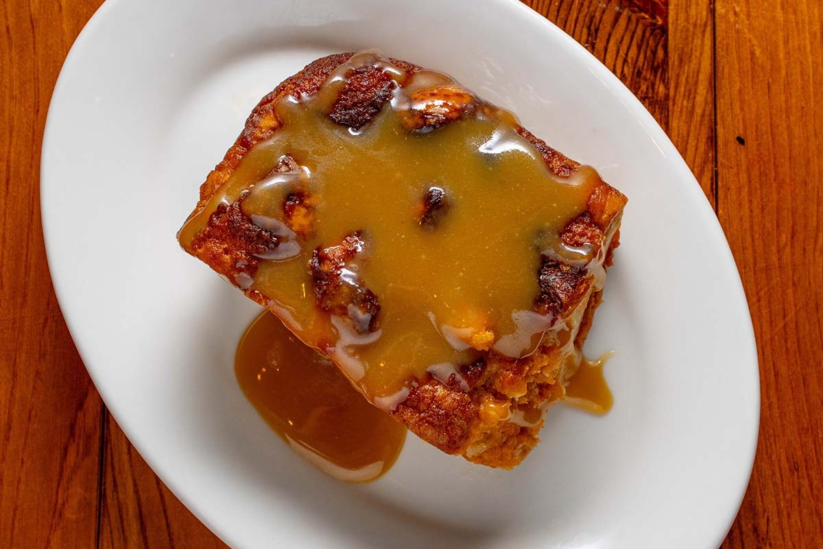 Order Sweet Potato Bread Pudding food online from Boudreaux Cajun Kitchen store, Houston on bringmethat.com