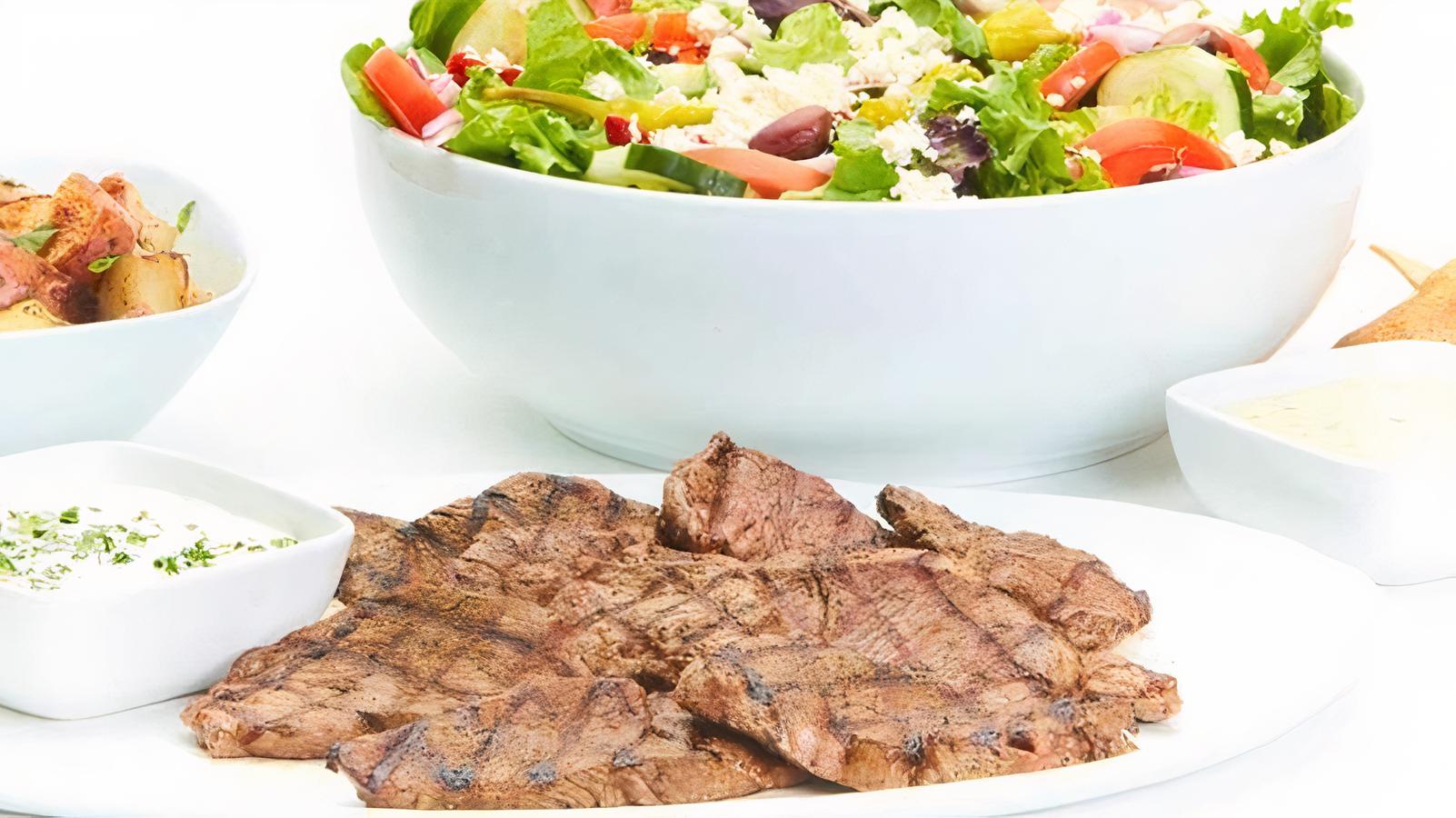 Order Chargrilled Lamb Family Feast for 4 food online from Taziki Cafe store, Tuscaloosa on bringmethat.com
