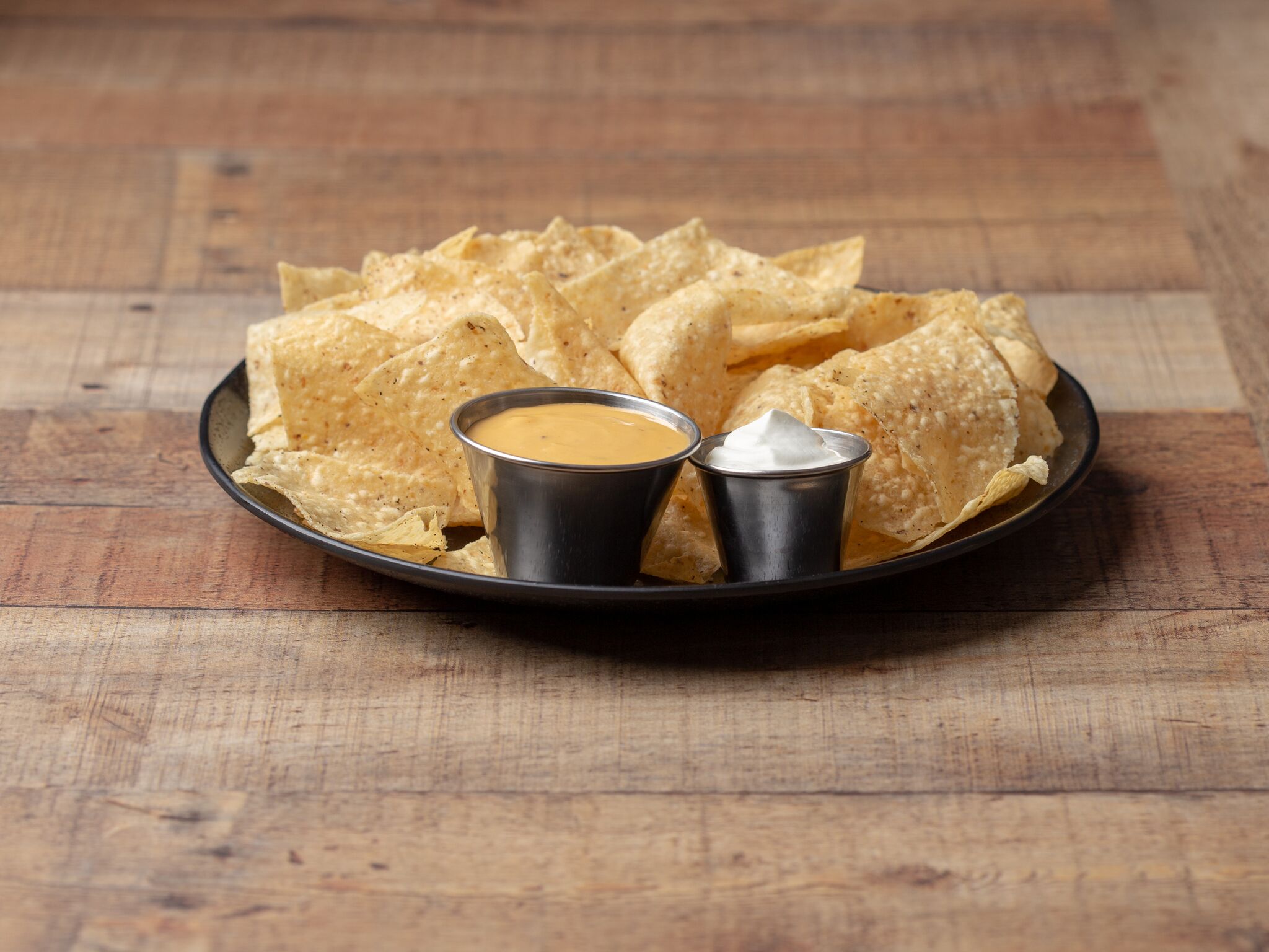 Order  Chips & Queso food online from Sol Burrito store, Rochester on bringmethat.com