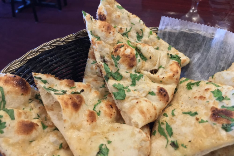 Order Garlic Naan food online from India Palace store, Rahway on bringmethat.com