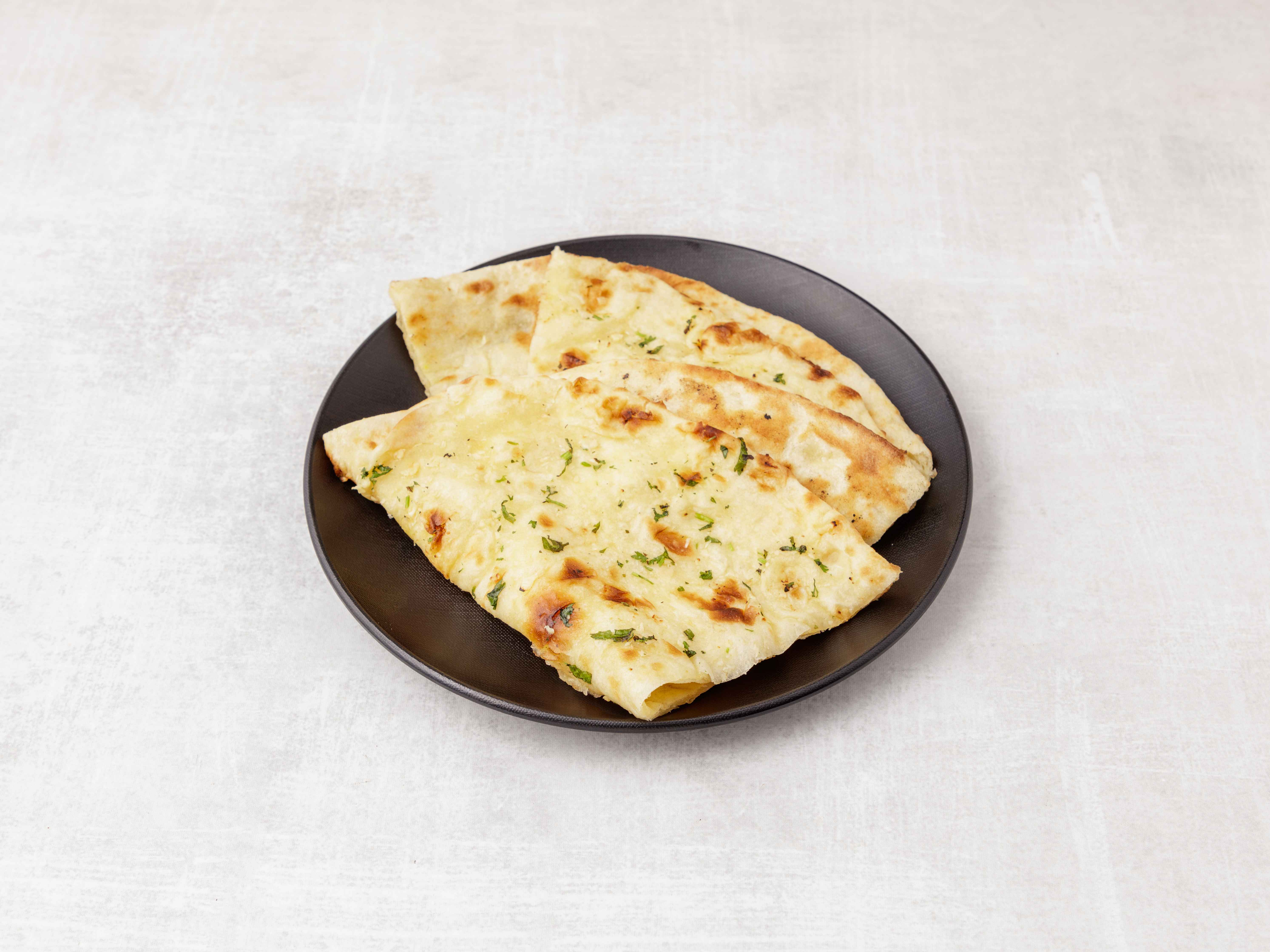 Order Garlic Naan food online from Bombay Olive store, West Hartford on bringmethat.com