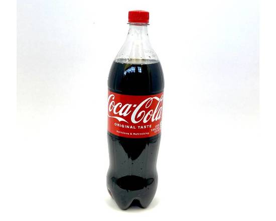 Order Coke 1.25 Liter food online from Fialkoff Kosher Pizza store, Lawrence on bringmethat.com