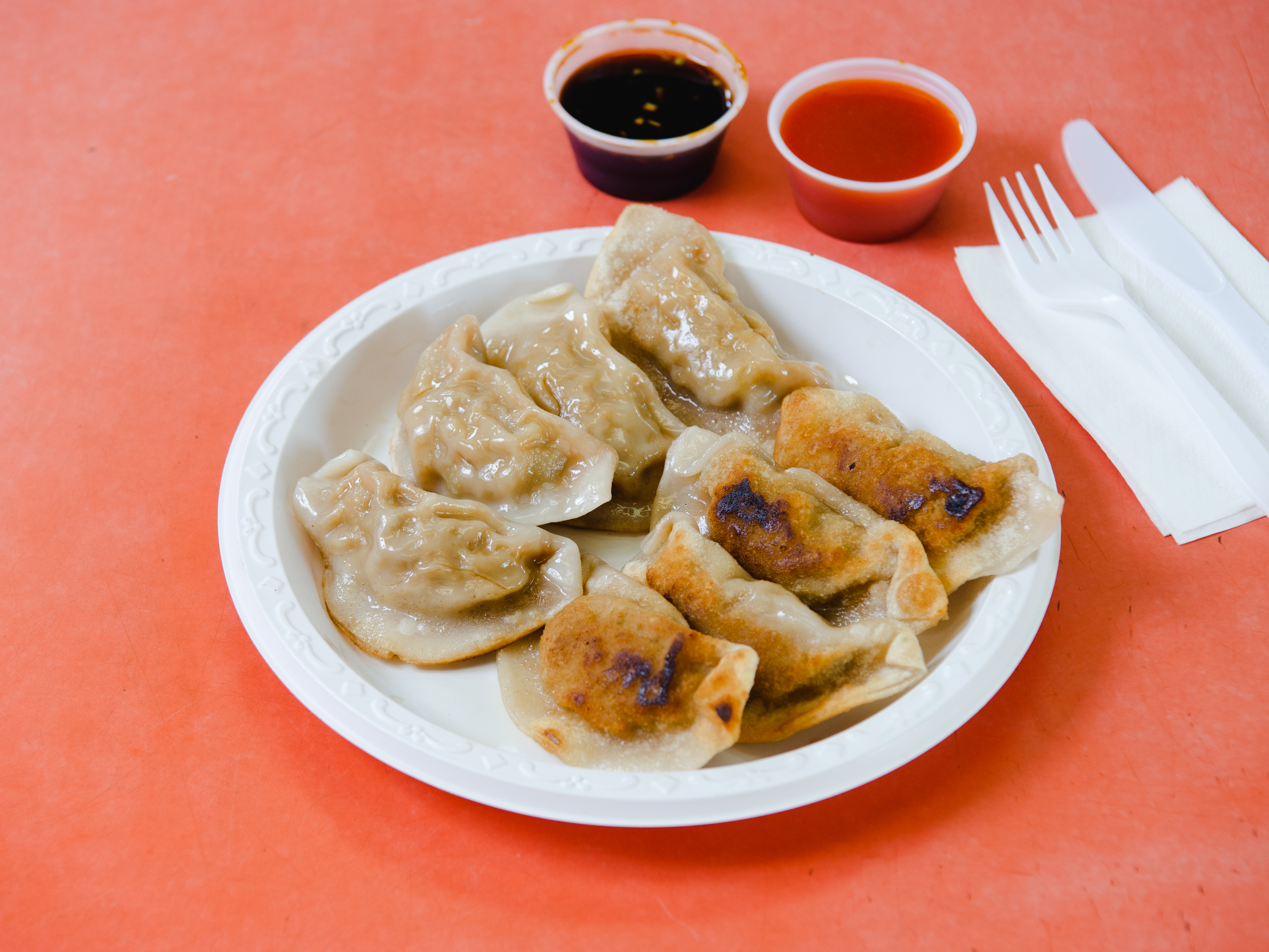 Order 9. Eight Pan Fried Dumplings food online from Happy Wok Chinese Restaurant store, Brooklyn on bringmethat.com