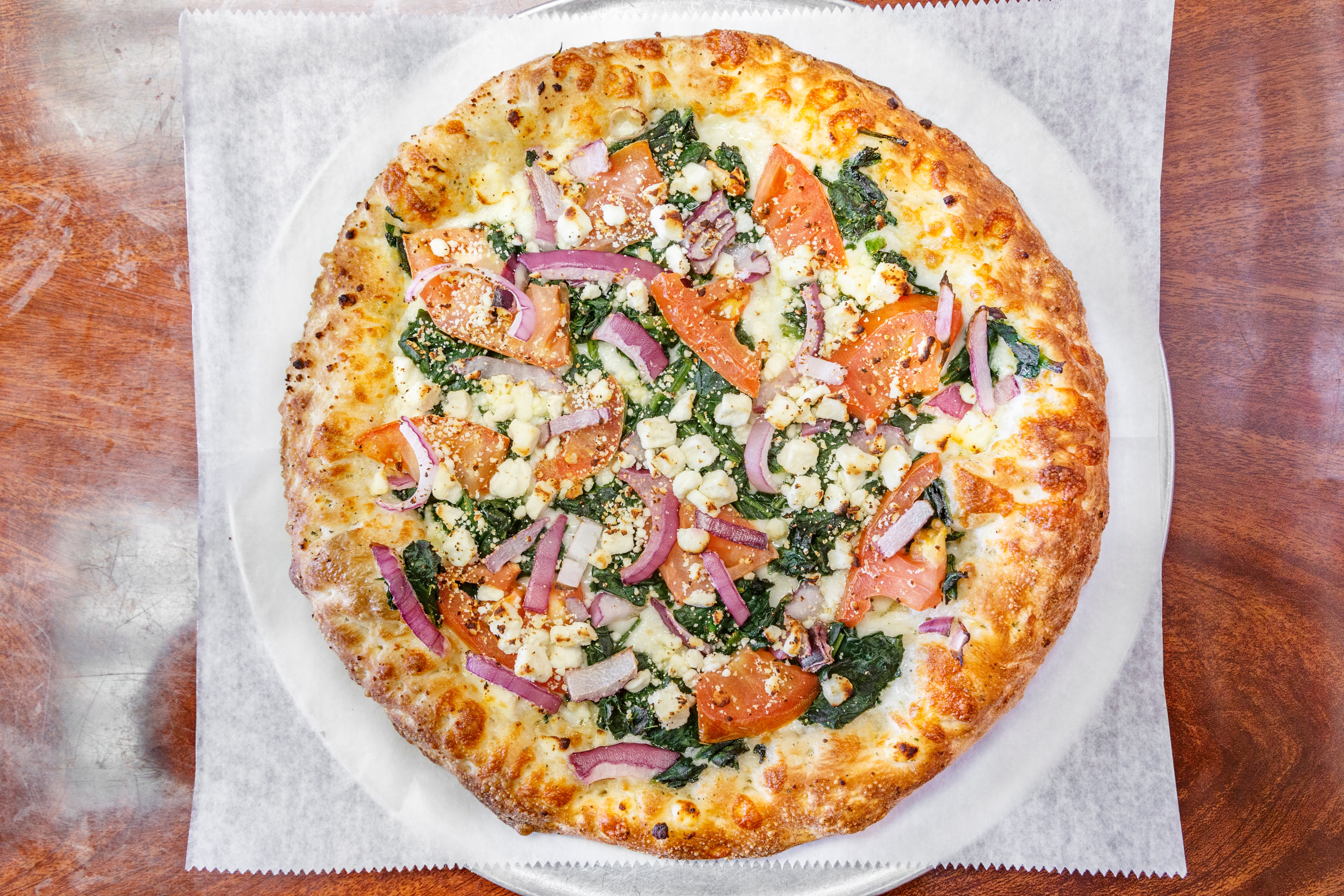 Order Spinach & Feta Pizza - Small 10" (4 Slices) food online from Peppercini Italian Restaurant & Lounge store, Mc Kees Rocks on bringmethat.com