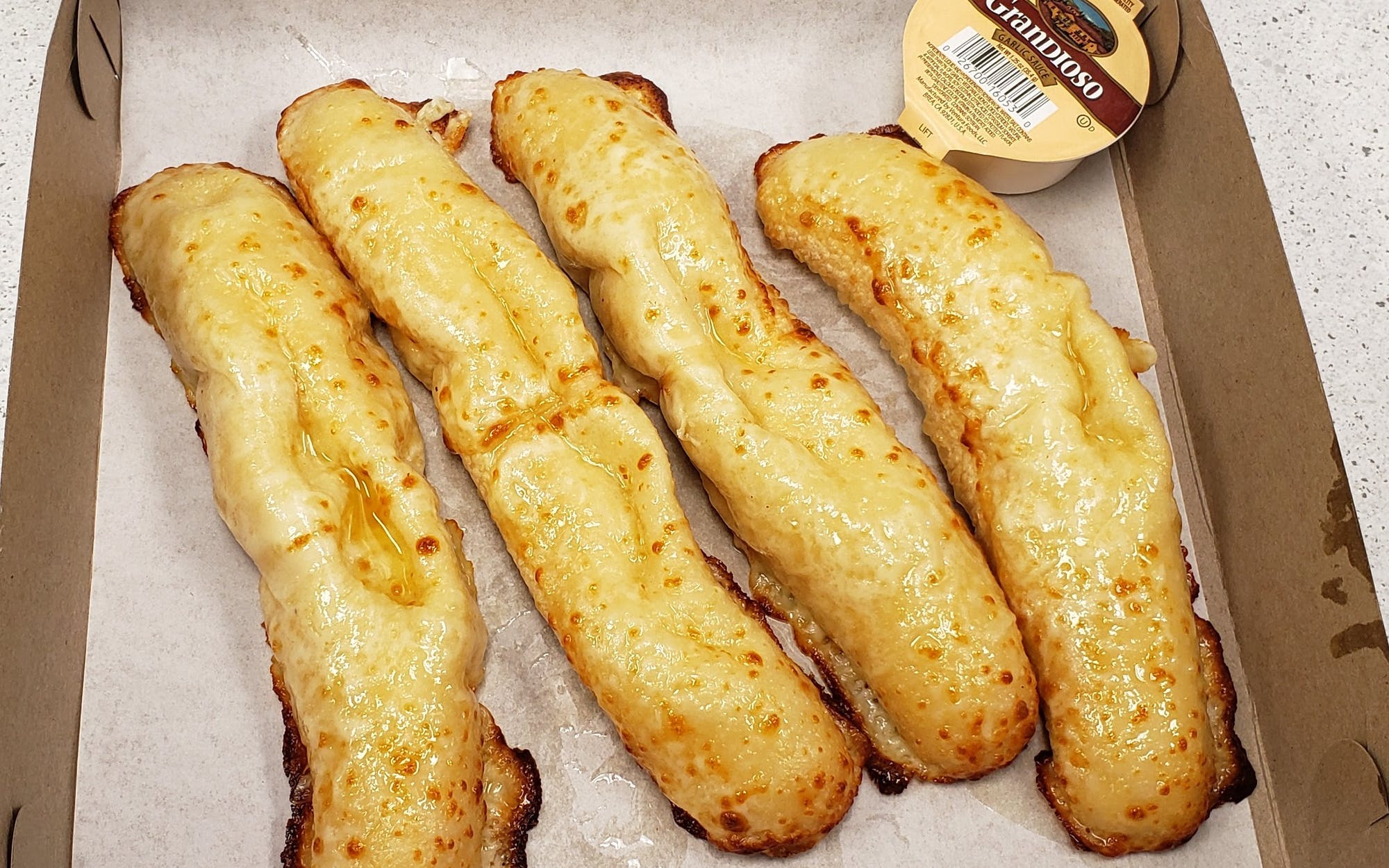 Order Breadsticks - Small food online from Pisanello's Pizza store, Waterville on bringmethat.com