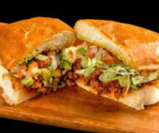 Order Adobada Torta food online from Filiberto Mexican Restaurant store, Surprise on bringmethat.com